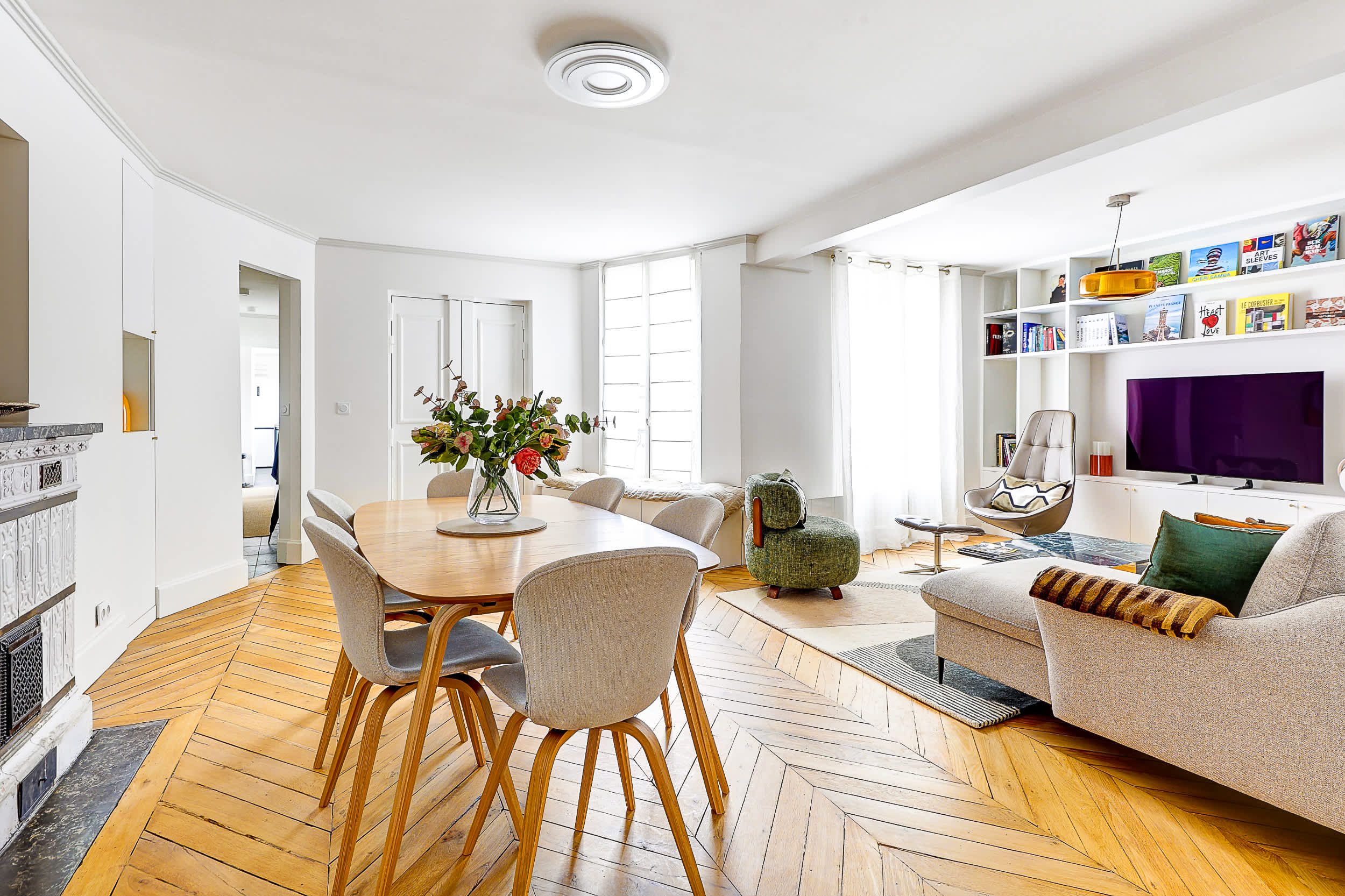 Bright and spacious living area with a sofa bed and dining space.