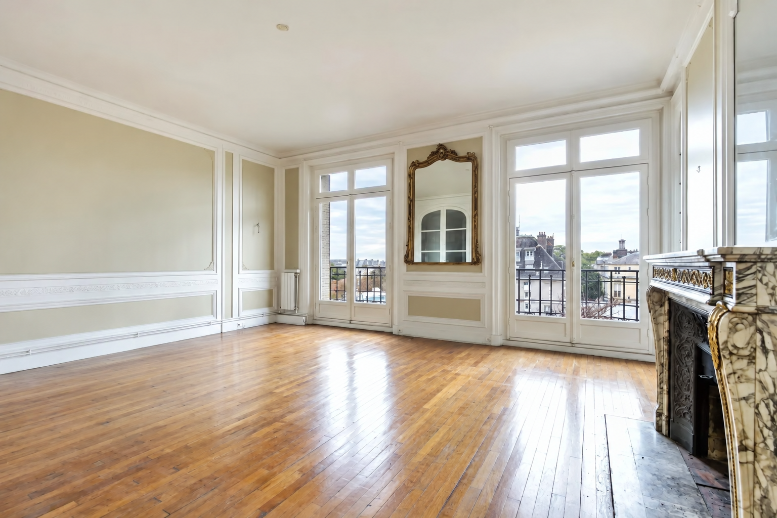 Bright living room with parquet and marble fireplace