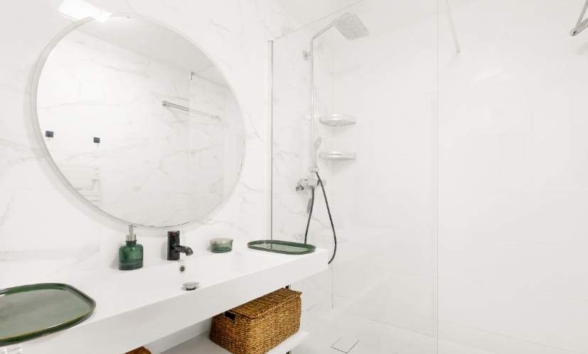 A fully equipped bathroom with a shower.