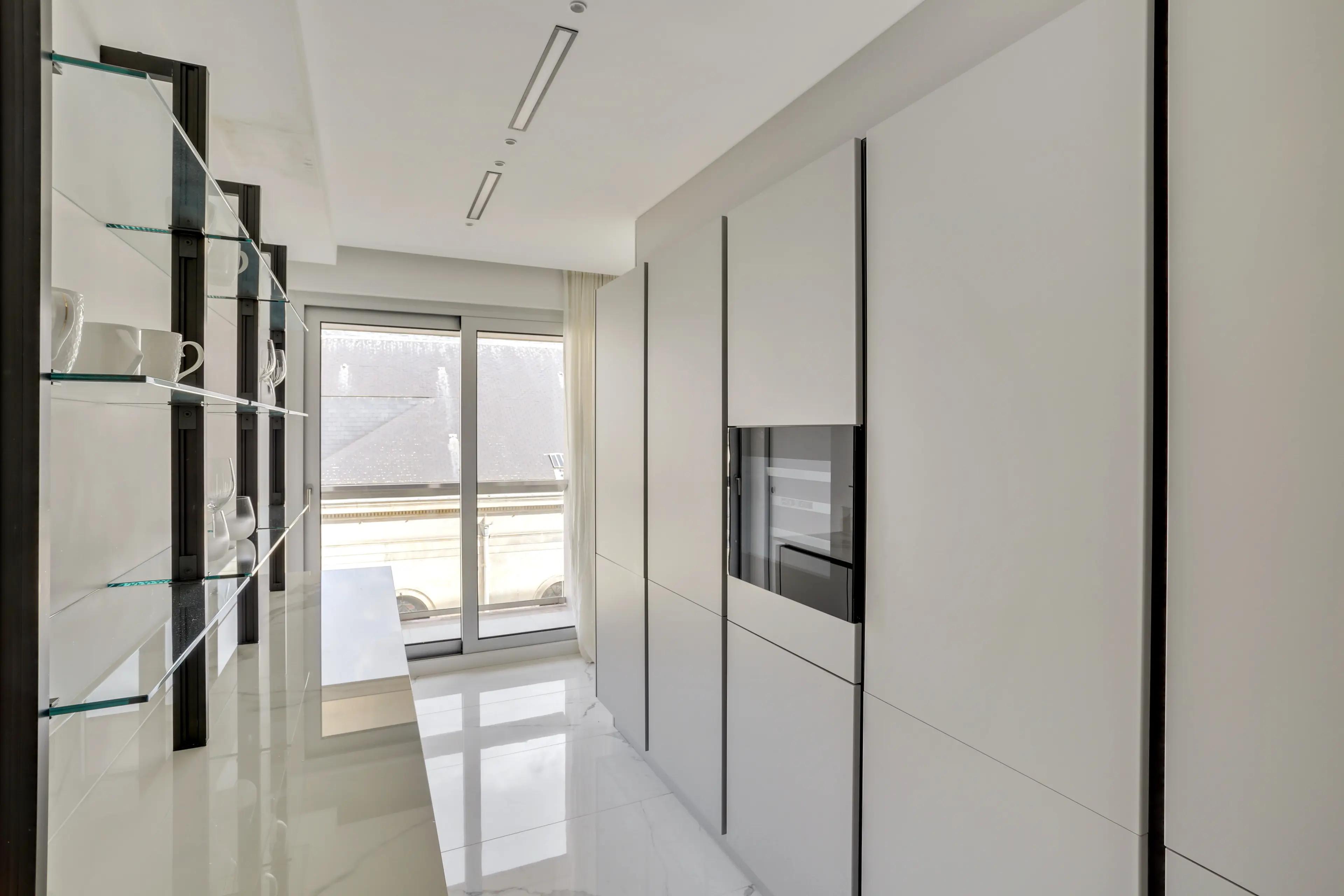 Renovated 4-bedroom duplex apartment for rent in Paris 7th arrondissement, bright living room with wraparound balcony and Paris rooftop view