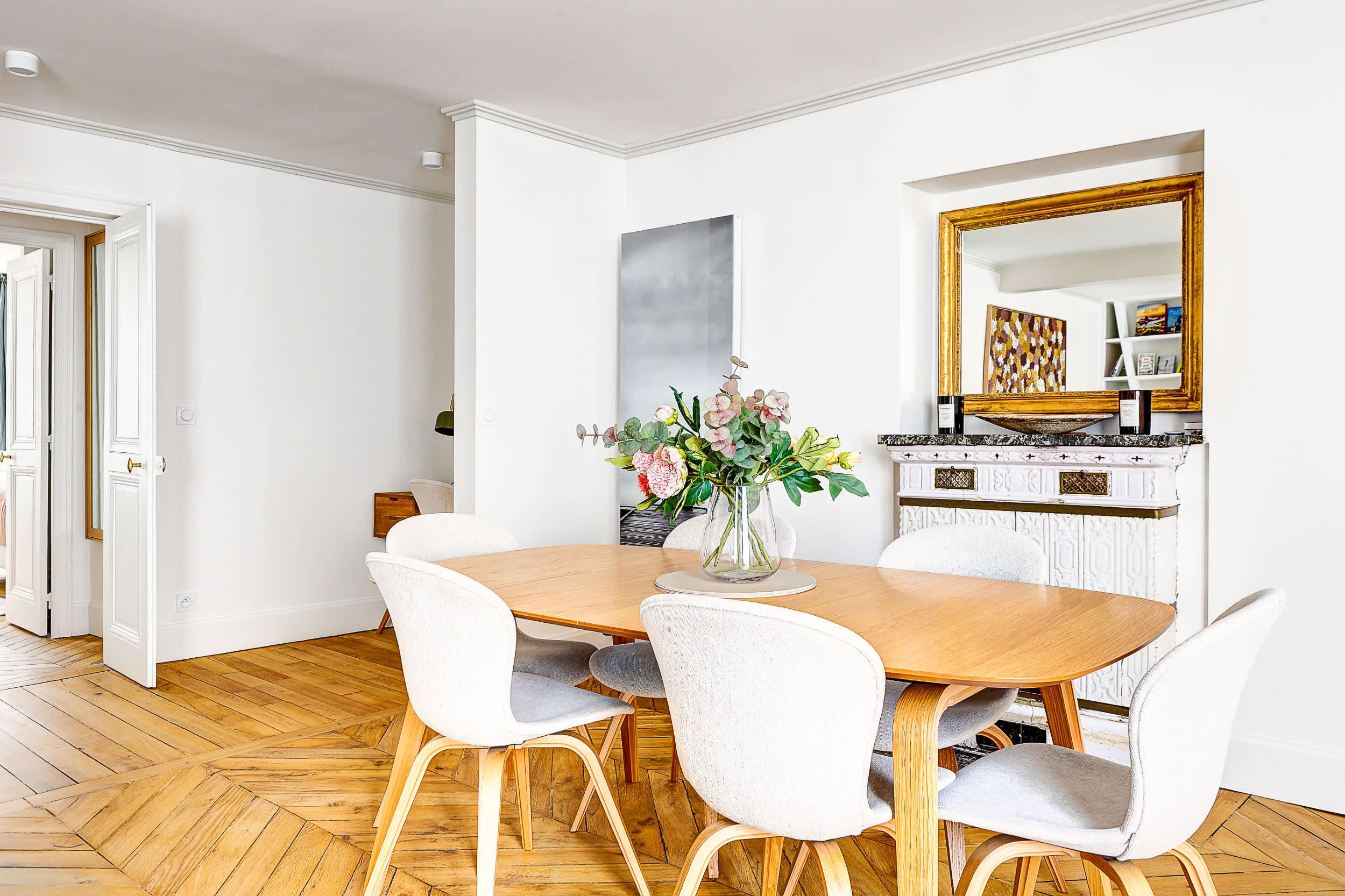 Bright and spacious living area with a sofa bed and dining space.
