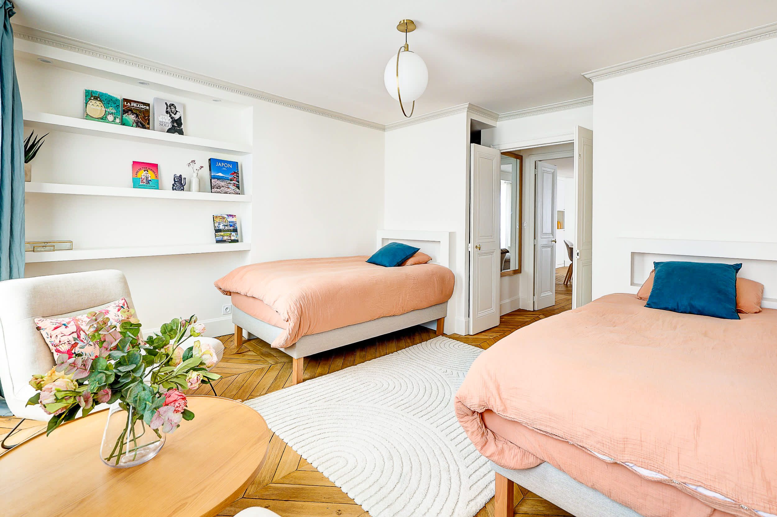 Bedroom 1: Two comfortable single beds and armchairs.