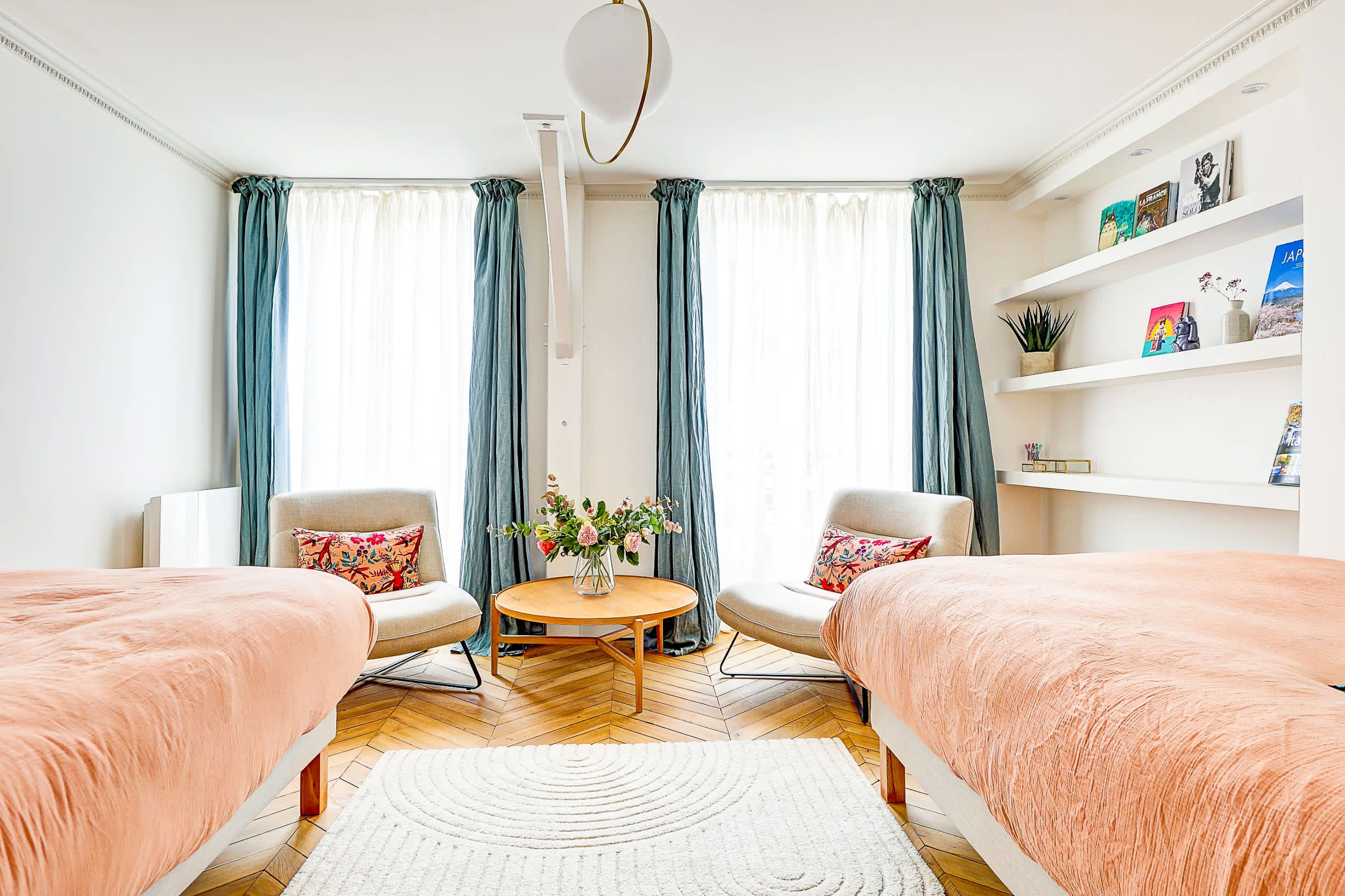 Bedroom 1: Two comfortable single beds and armchairs.
