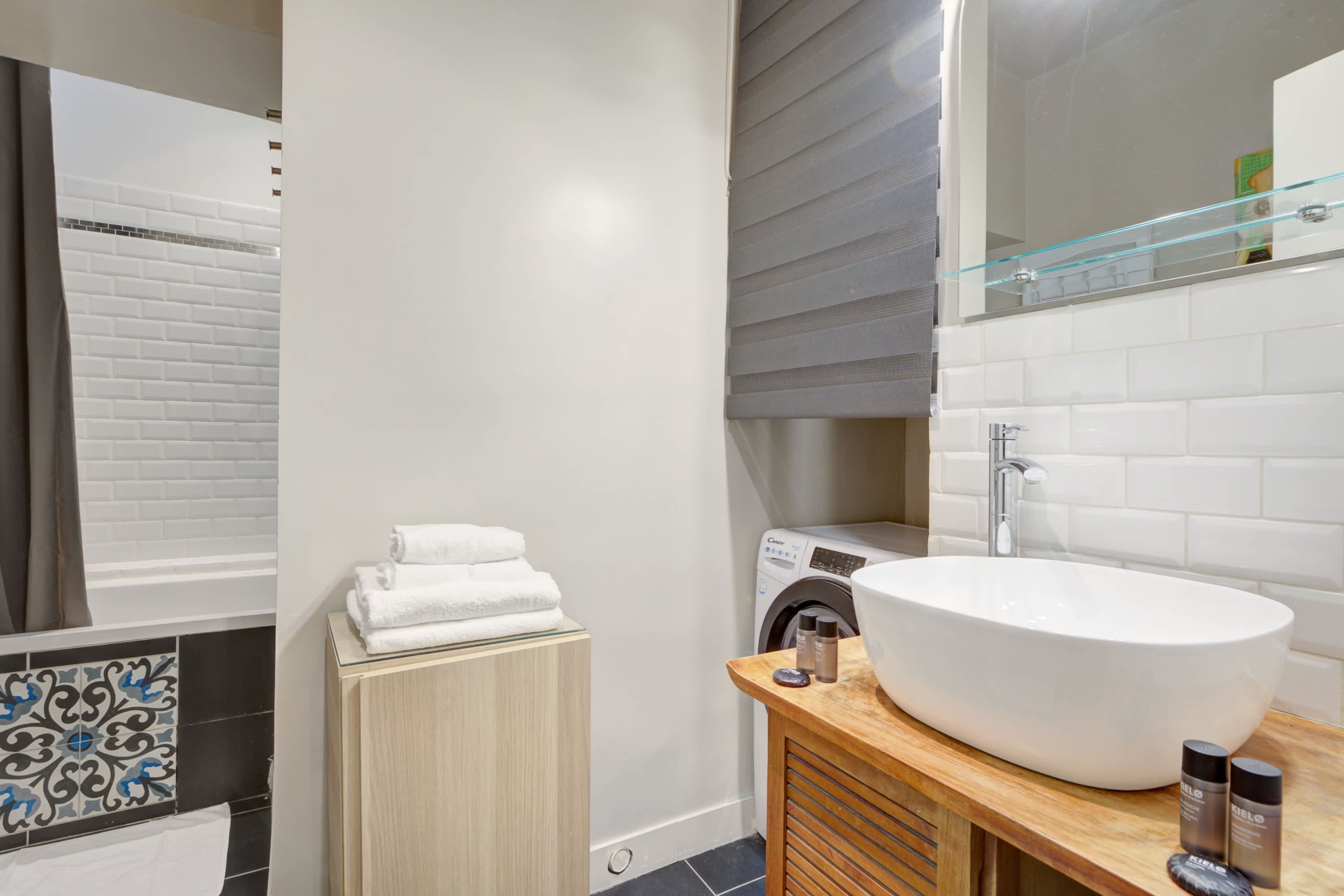 Bathroom: shower, sink, mirror, and toilet
