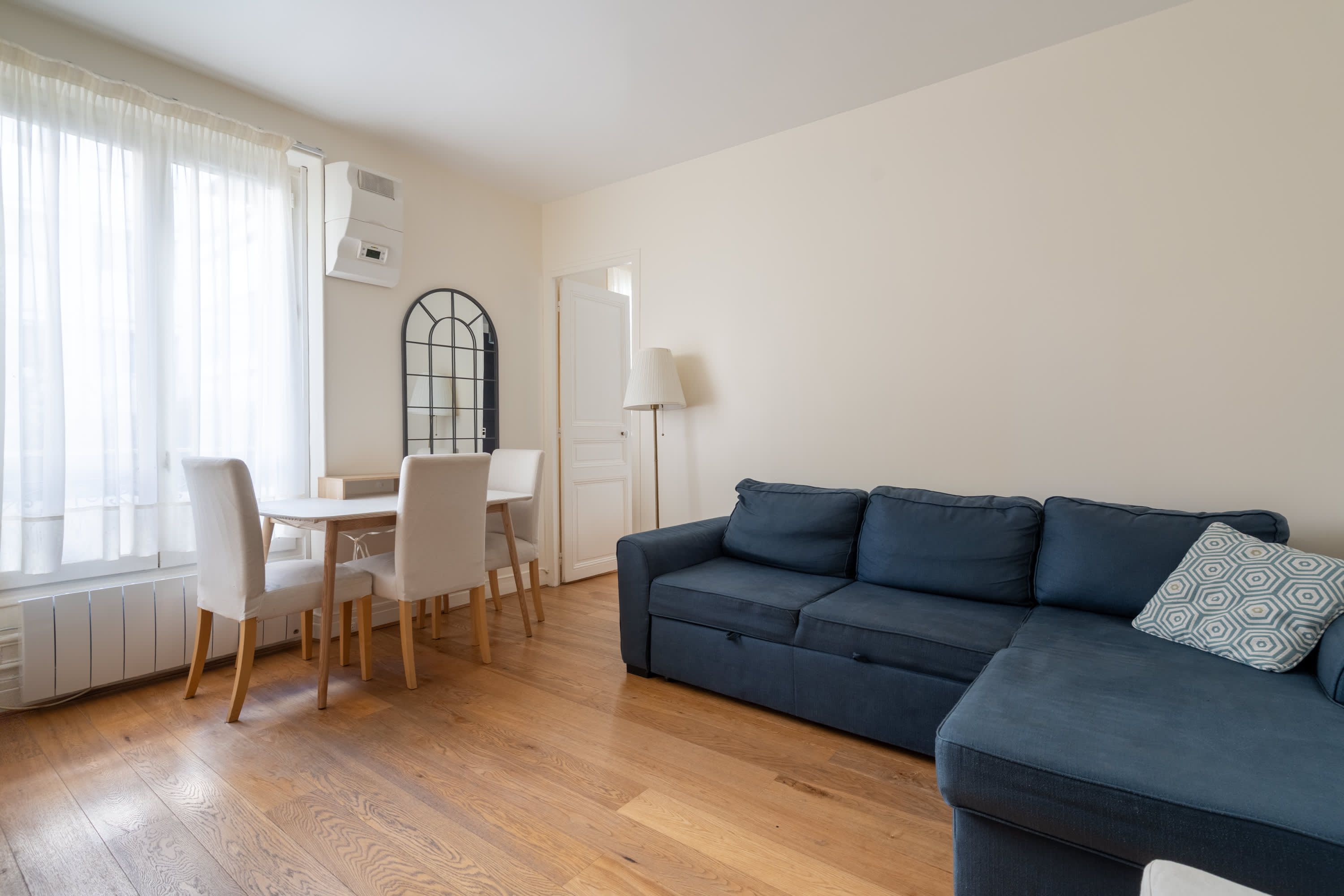 Elegant Parisian apartments with bright living areas, cozy bedrooms, and fully equipped kitchens.