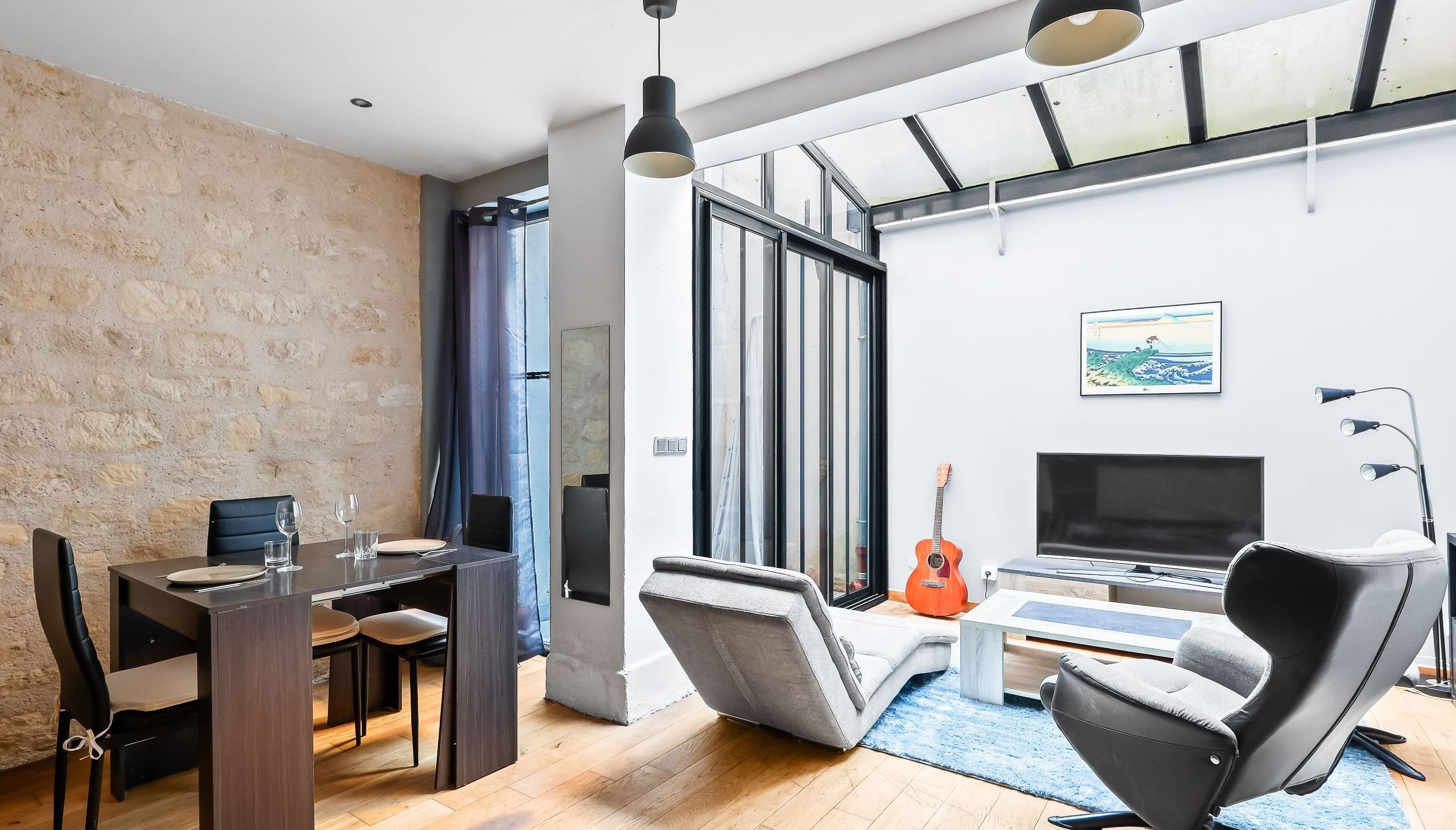 Living area with a comfortable sofa and a smart TV.