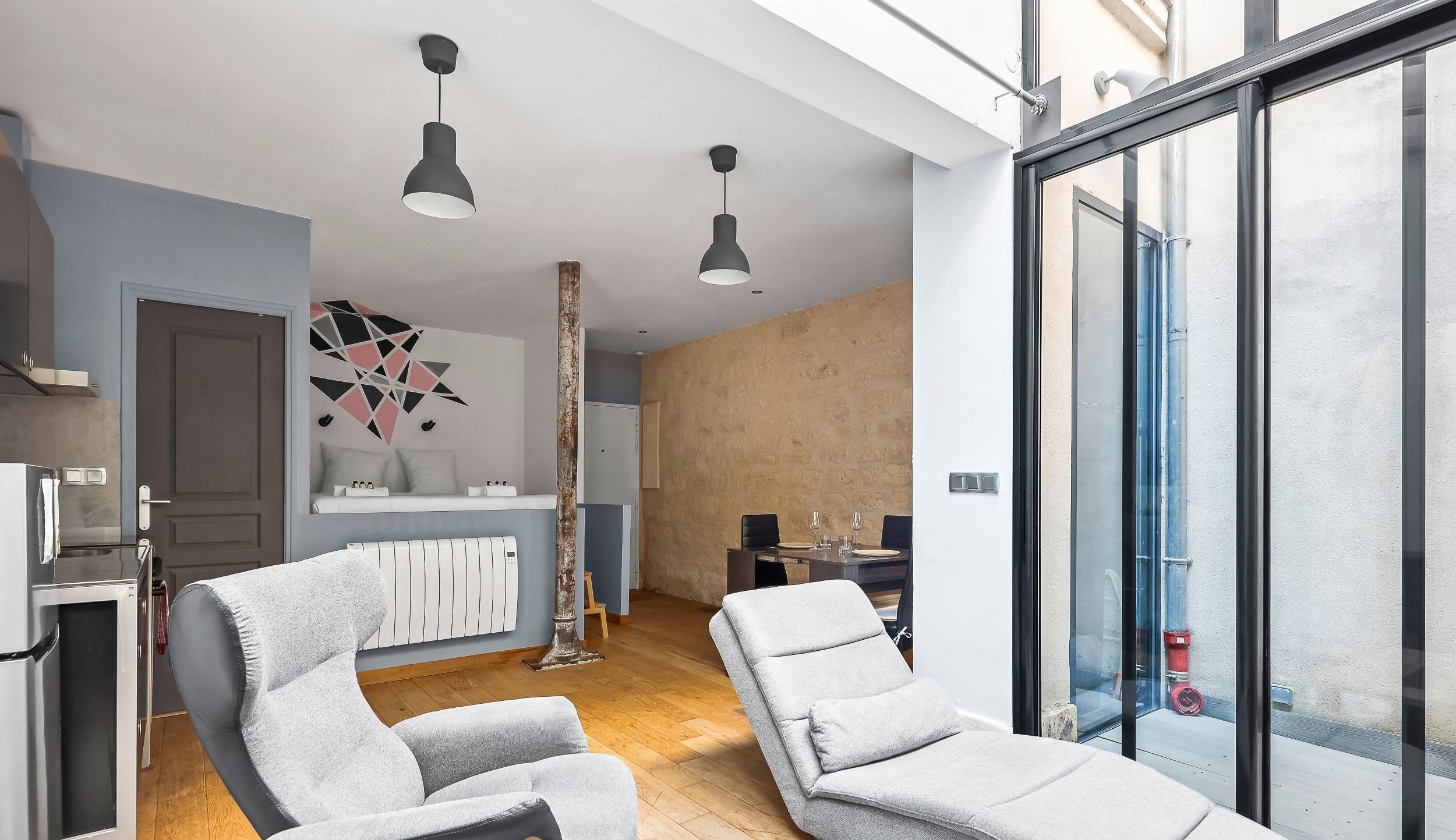 Living area with a comfortable sofa and a smart TV.