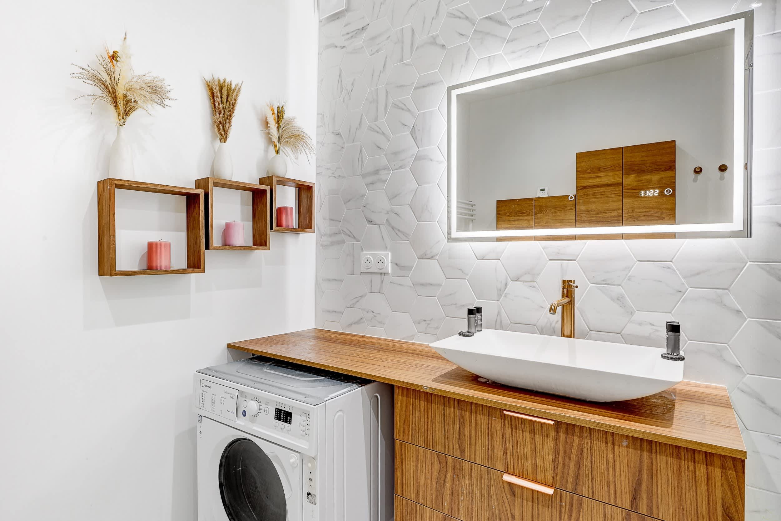 Top-floor Haussmann apartment on rue Meslay near République Paris 3rd, bright dual-aspect living room with designer sofa bed and refined decor