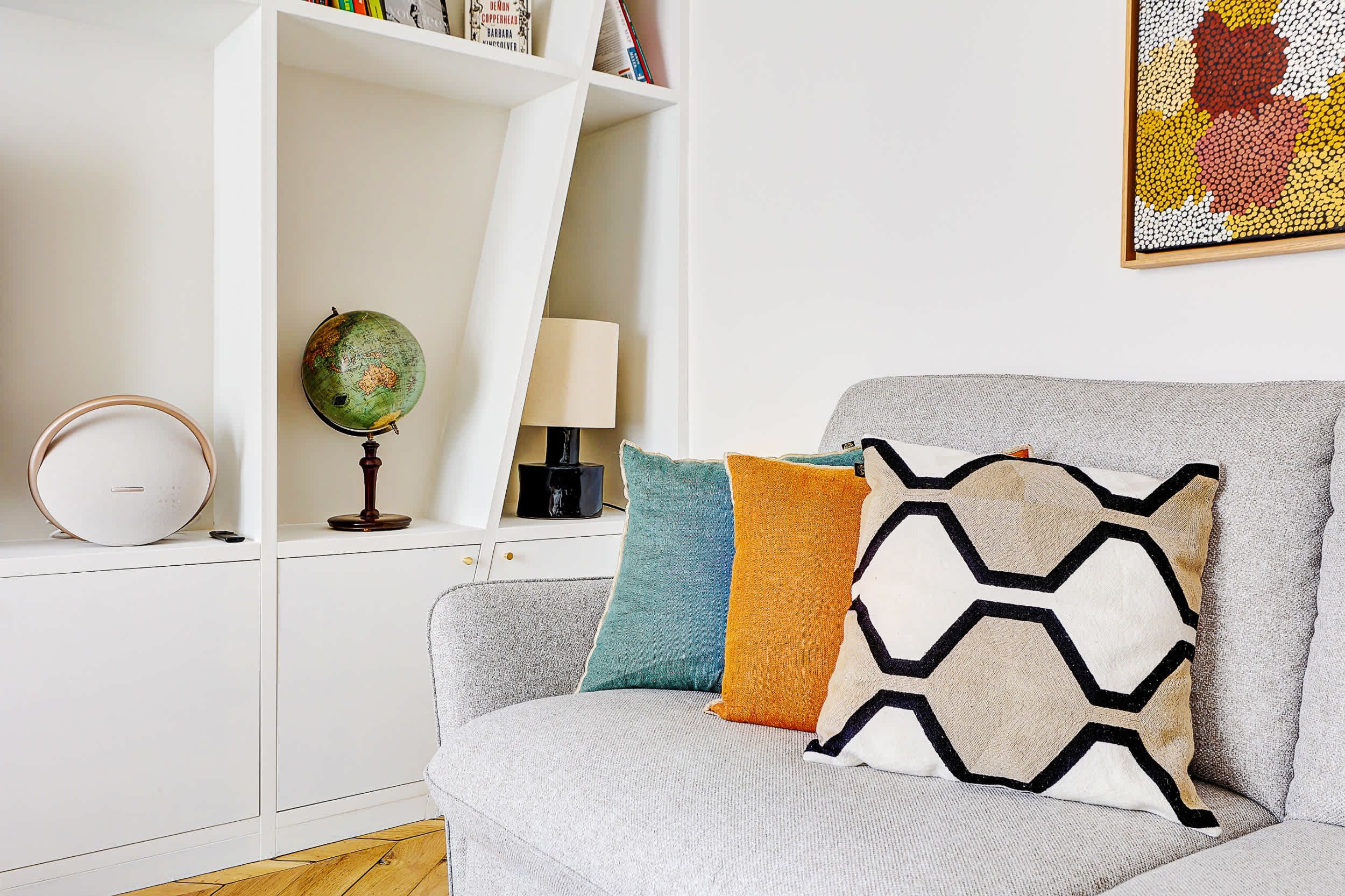 Bright and spacious living area with a sofa bed and dining space.