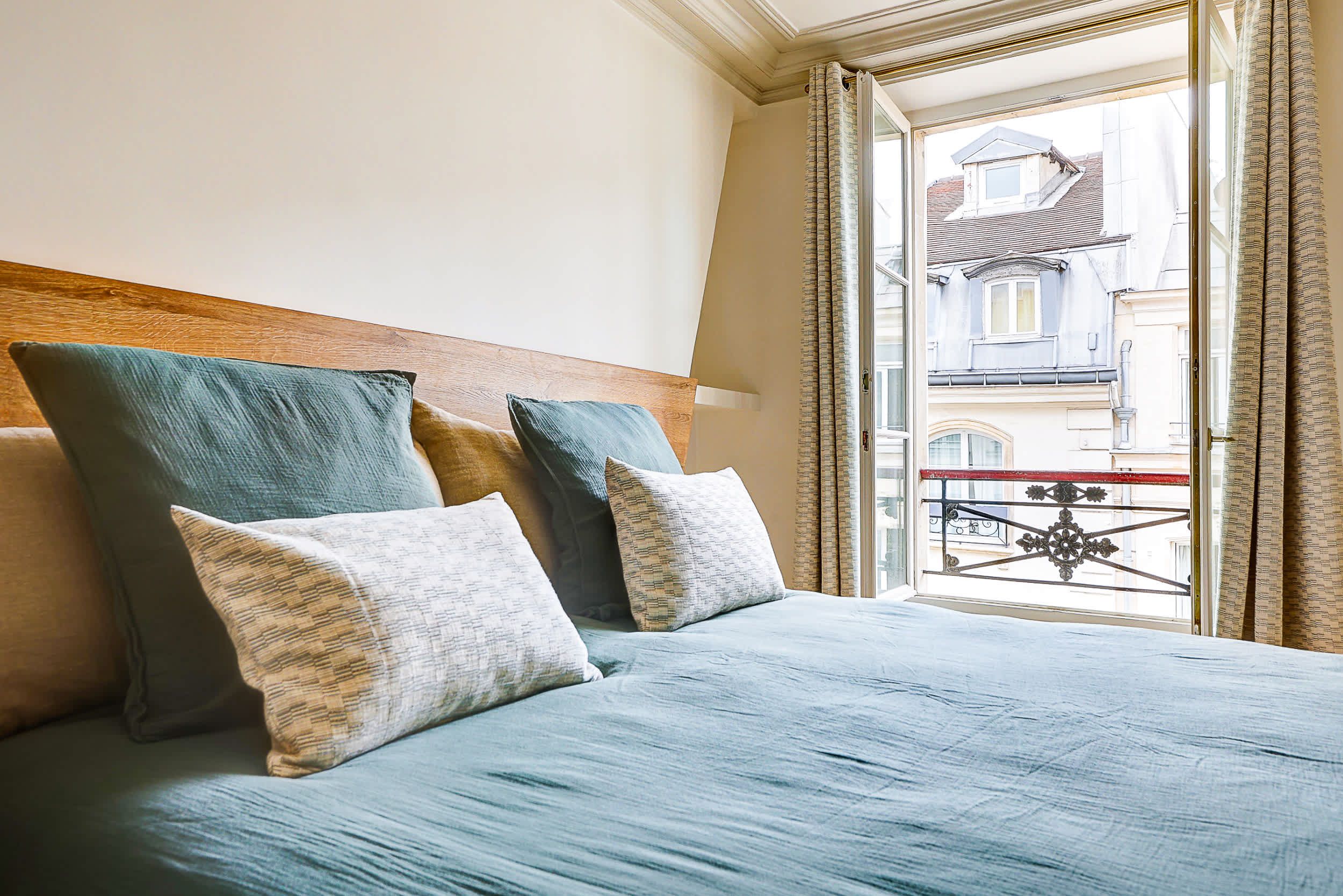 Bedroom 2: Comfortable double bed and a dedicated workspace with a desk.