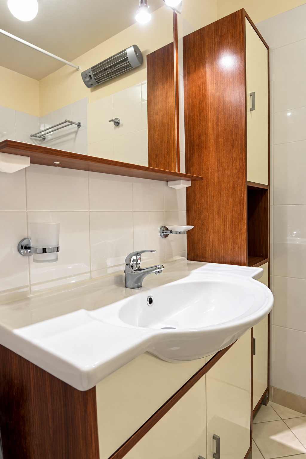 Bathroom vanity with mirror and storage in furnished studio