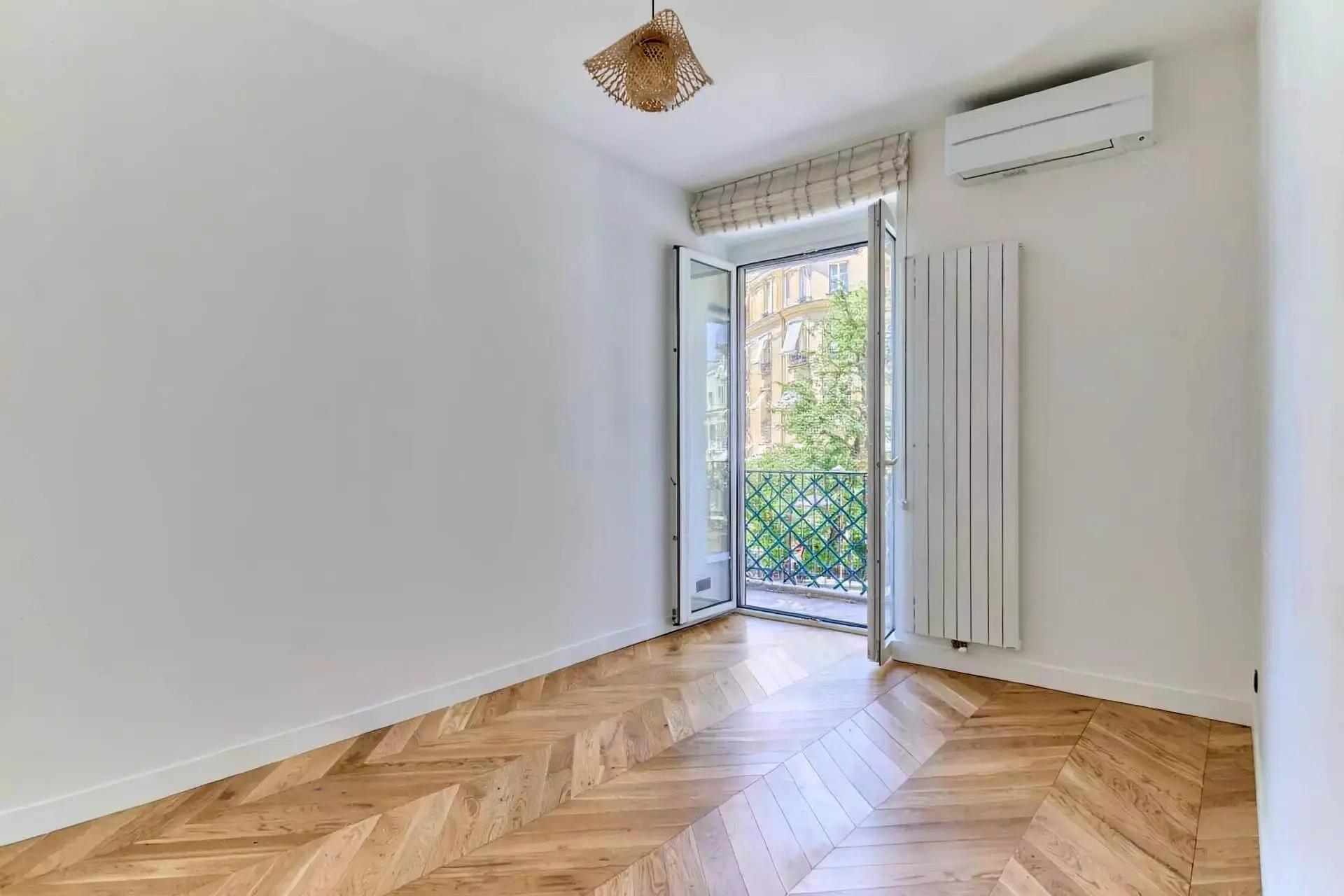 Bright fully furnished Paris apartment with elegant interiors, spacious living areas, balcony access, and comfortable amenities.