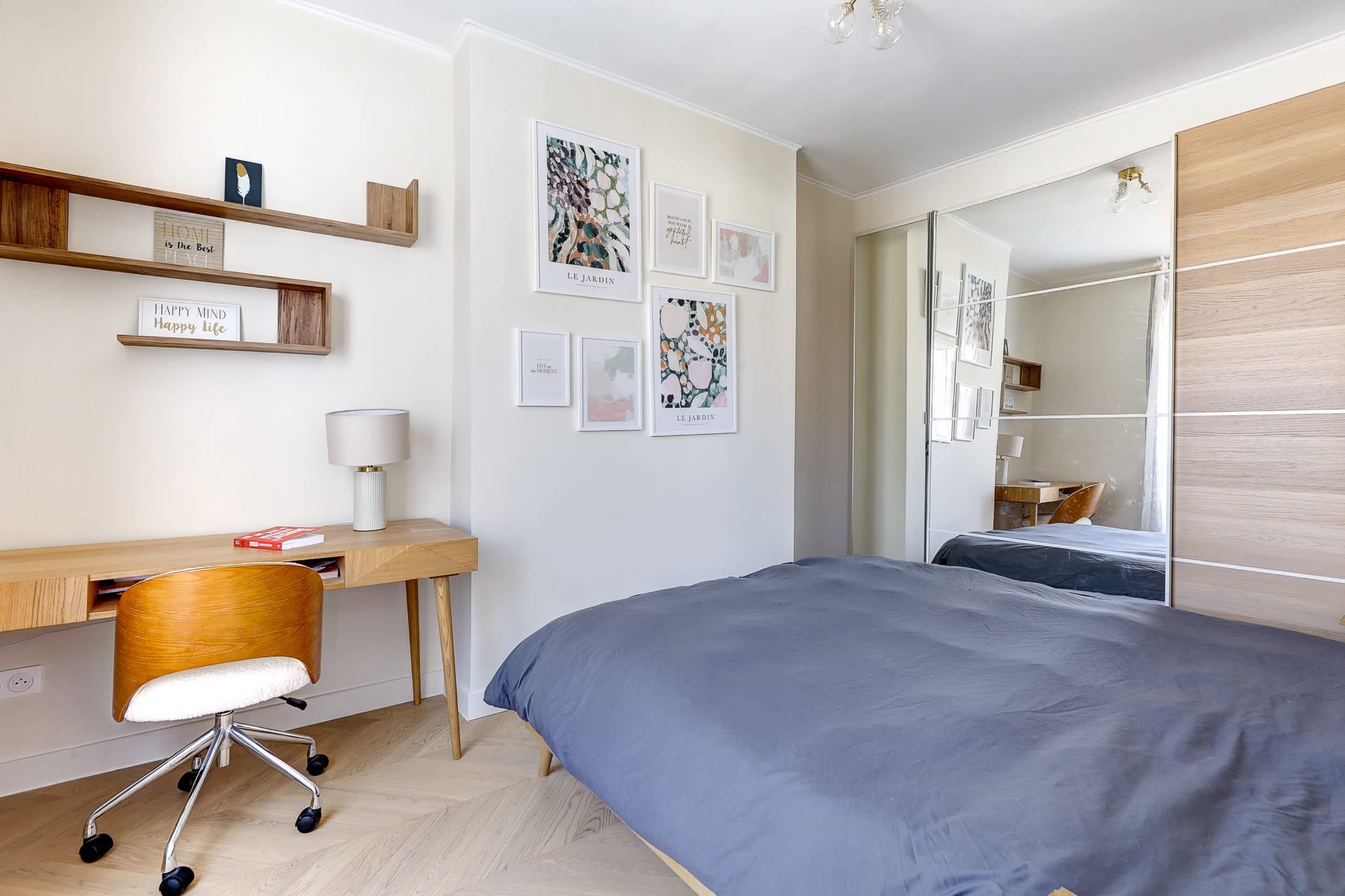 Top-floor Haussmann apartment on rue Meslay near République Paris 3rd, bright dual-aspect living room with designer sofa bed and refined decor