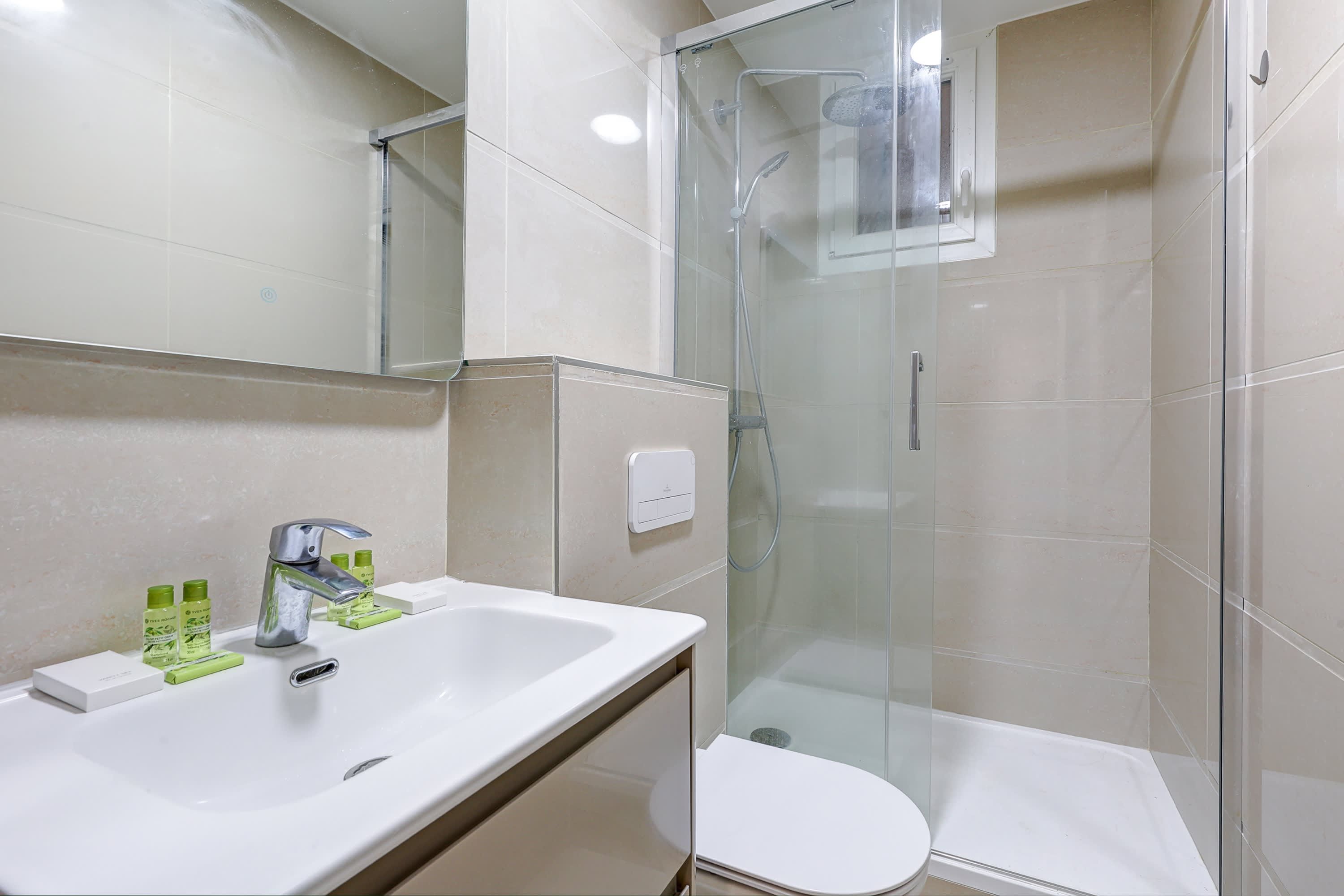 The sophisticated bathroom combines understated elegance with everyday comfort, offering a relaxing space to unwind.