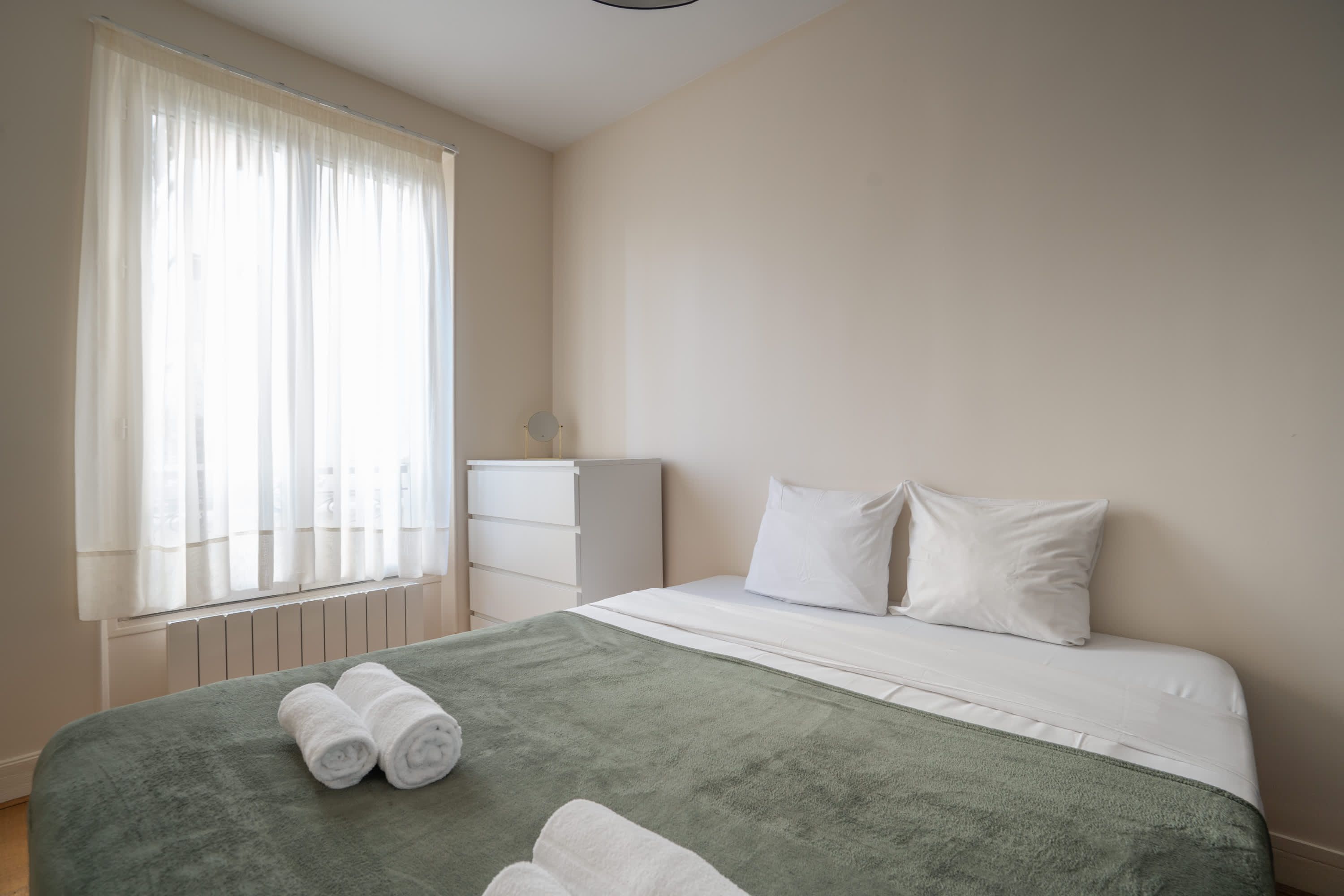 Elegant Parisian apartments with bright living areas, cozy bedrooms, and fully equipped kitchens.