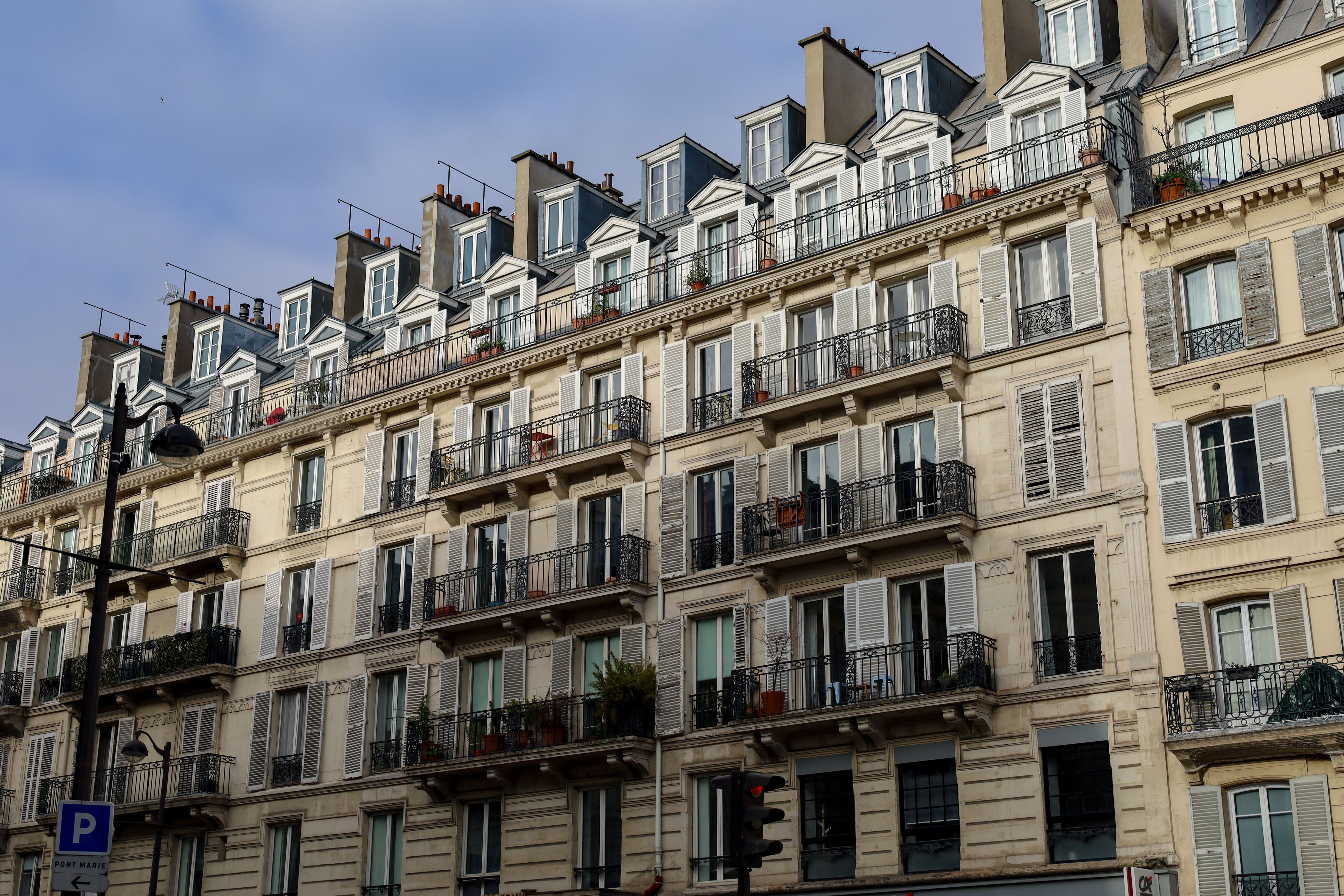 American family completing their Paris move-in checklist and French administrative steps after relocation from the US