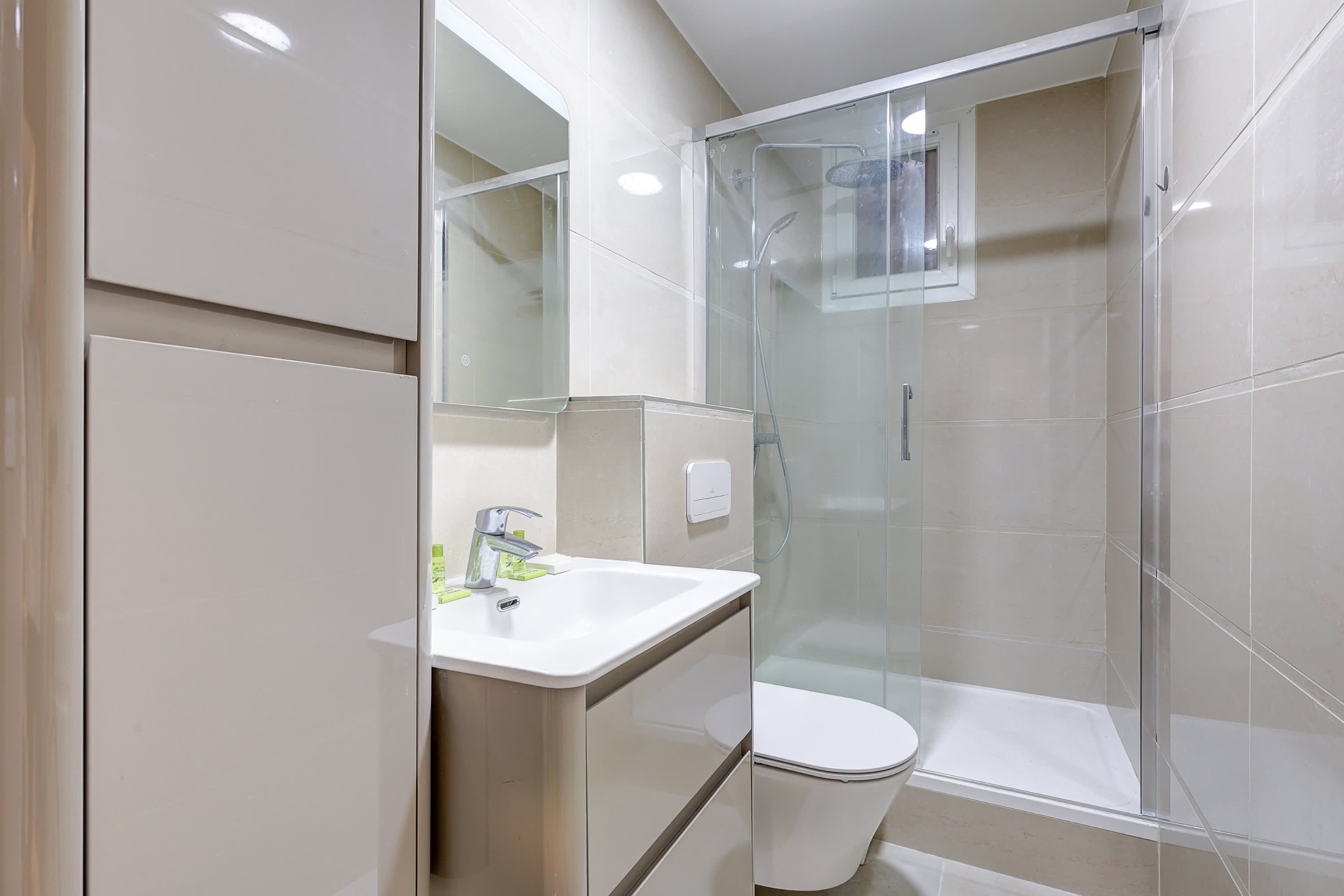 The sophisticated bathroom combines understated elegance with everyday comfort, offering a relaxing space to unwind.