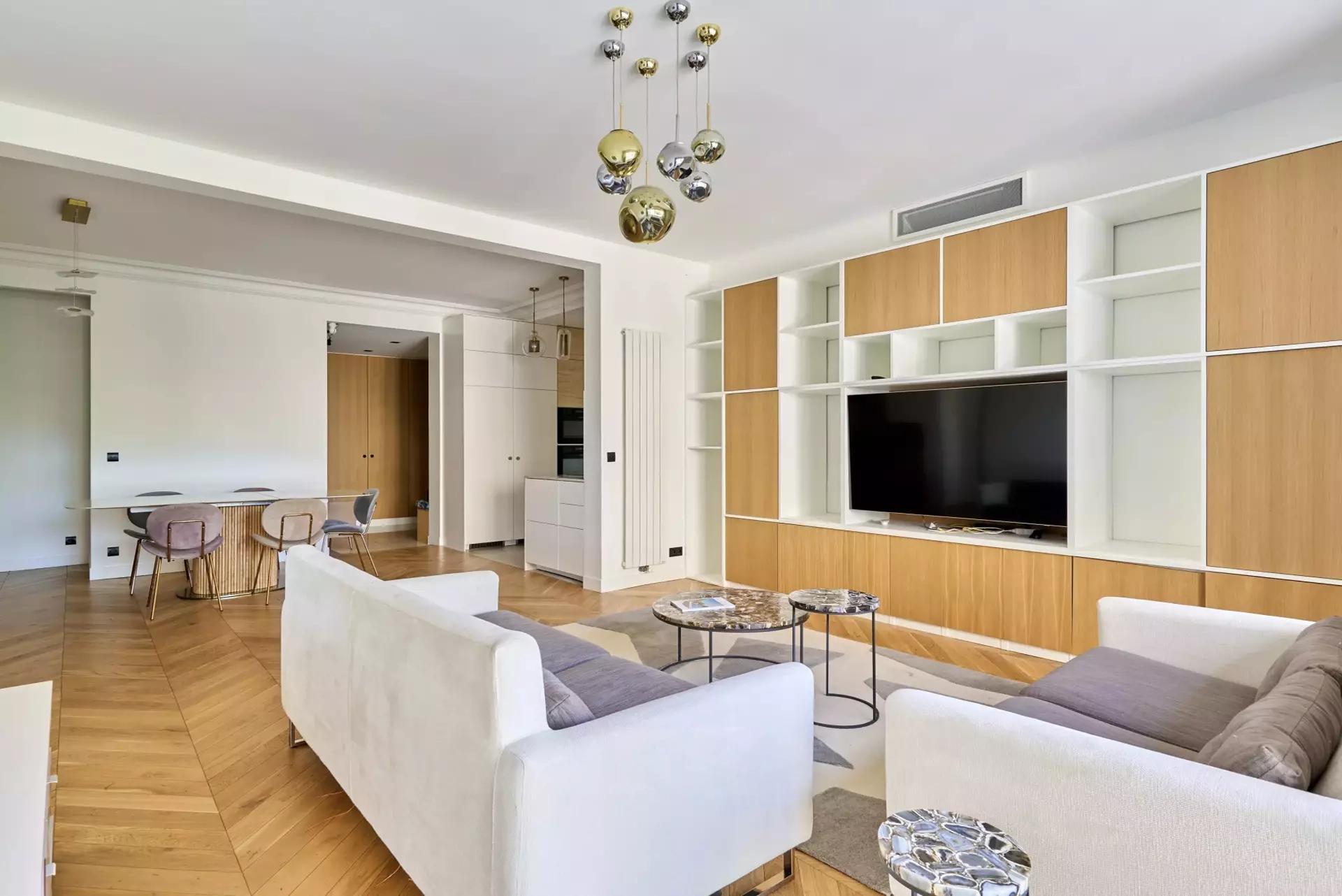 Bright fully furnished Paris apartment with elegant interiors, spacious living areas, balcony access, and comfortable amenities.