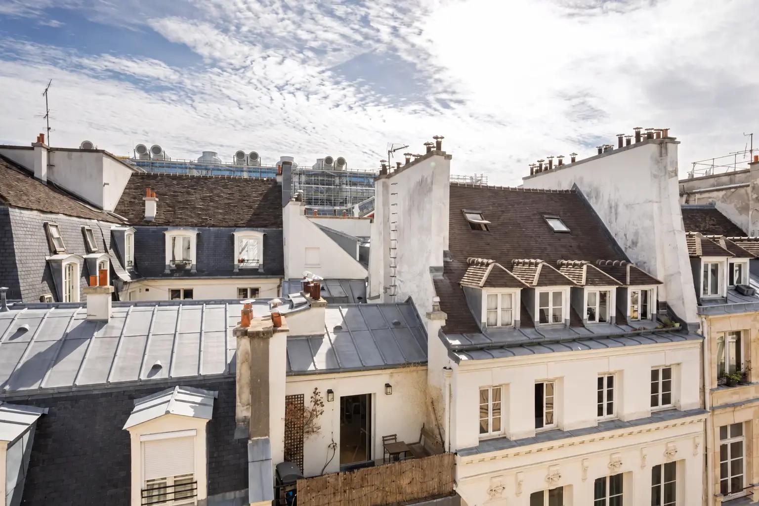 Open view across Paris rooftops towards Beaubourg