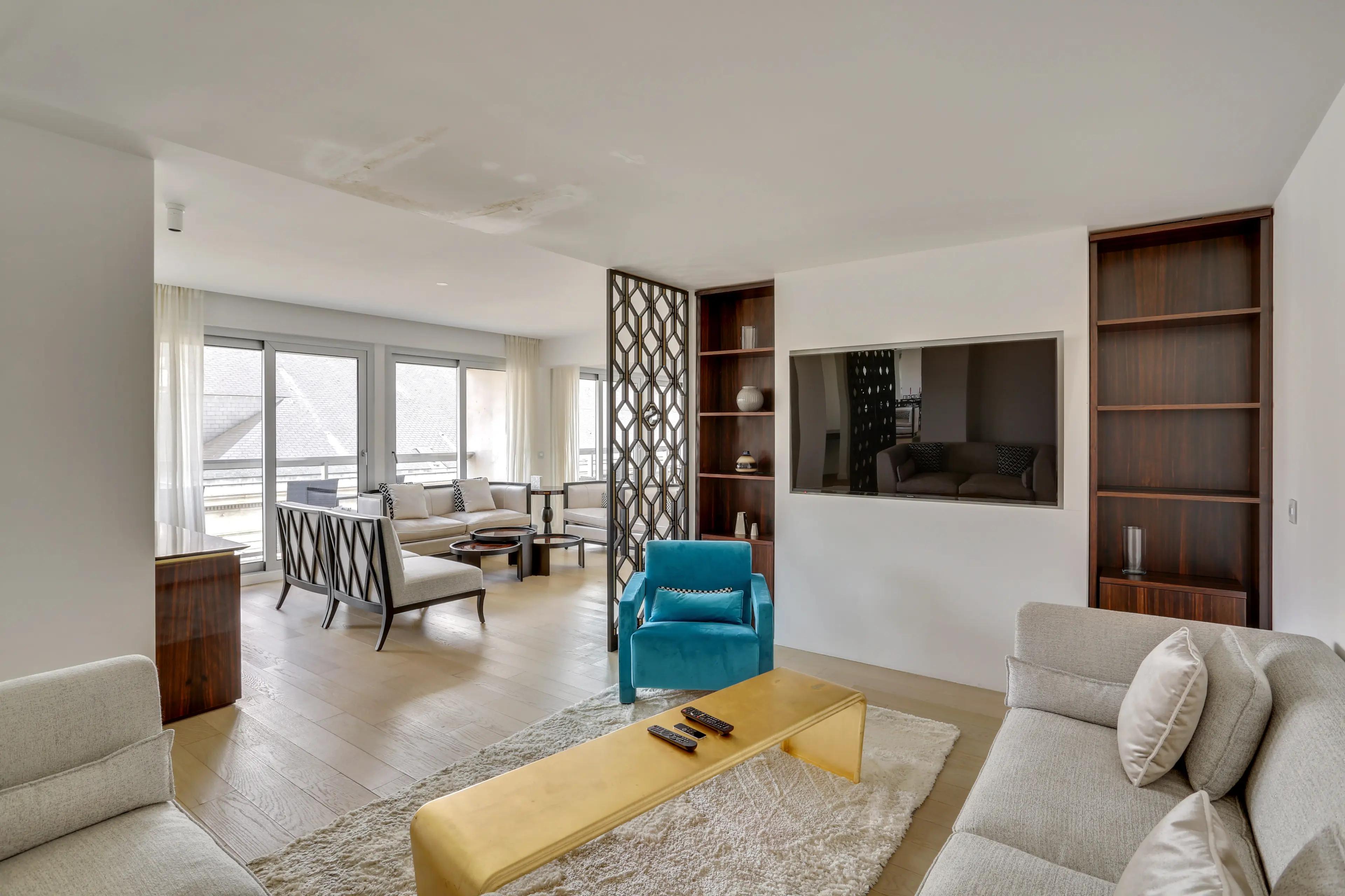 Renovated 4-bedroom duplex apartment for rent in Paris 7th arrondissement, bright living room with wraparound balcony and Paris rooftop view