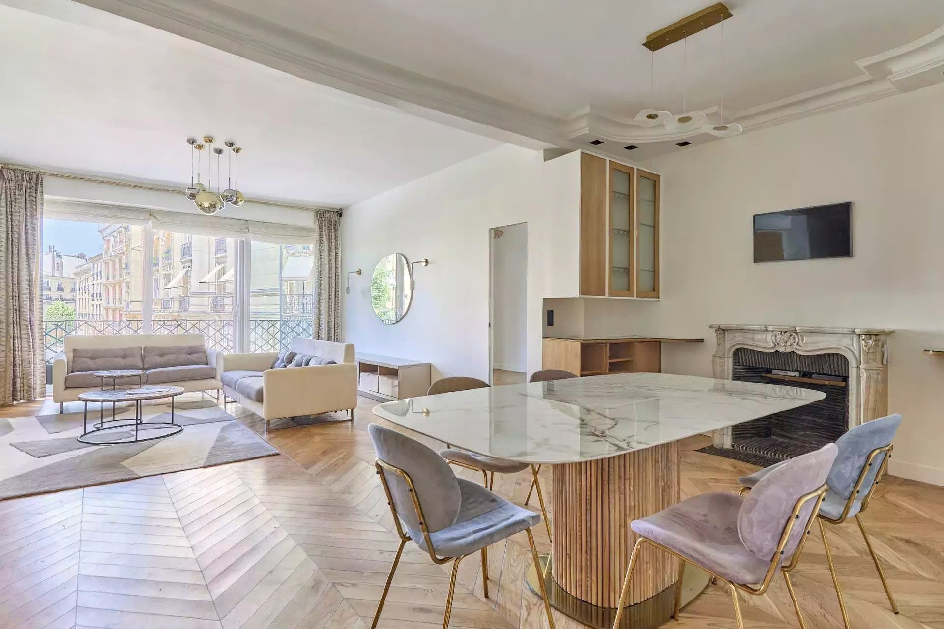 Bright fully furnished Paris apartment with elegant interiors, spacious living areas, balcony access, and comfortable amenities.