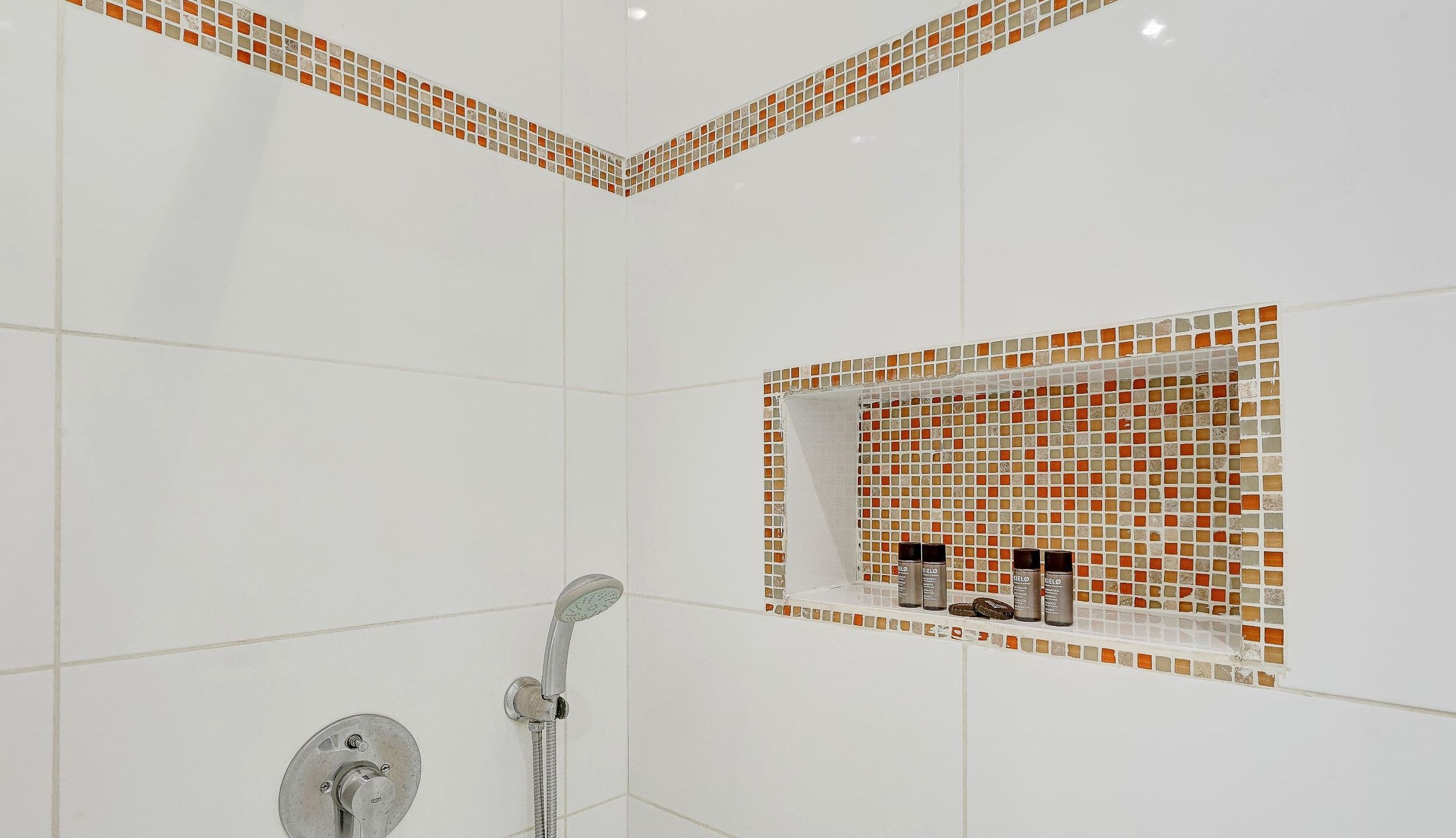 Bathroom: shower, washbasin, mirror, and toilet