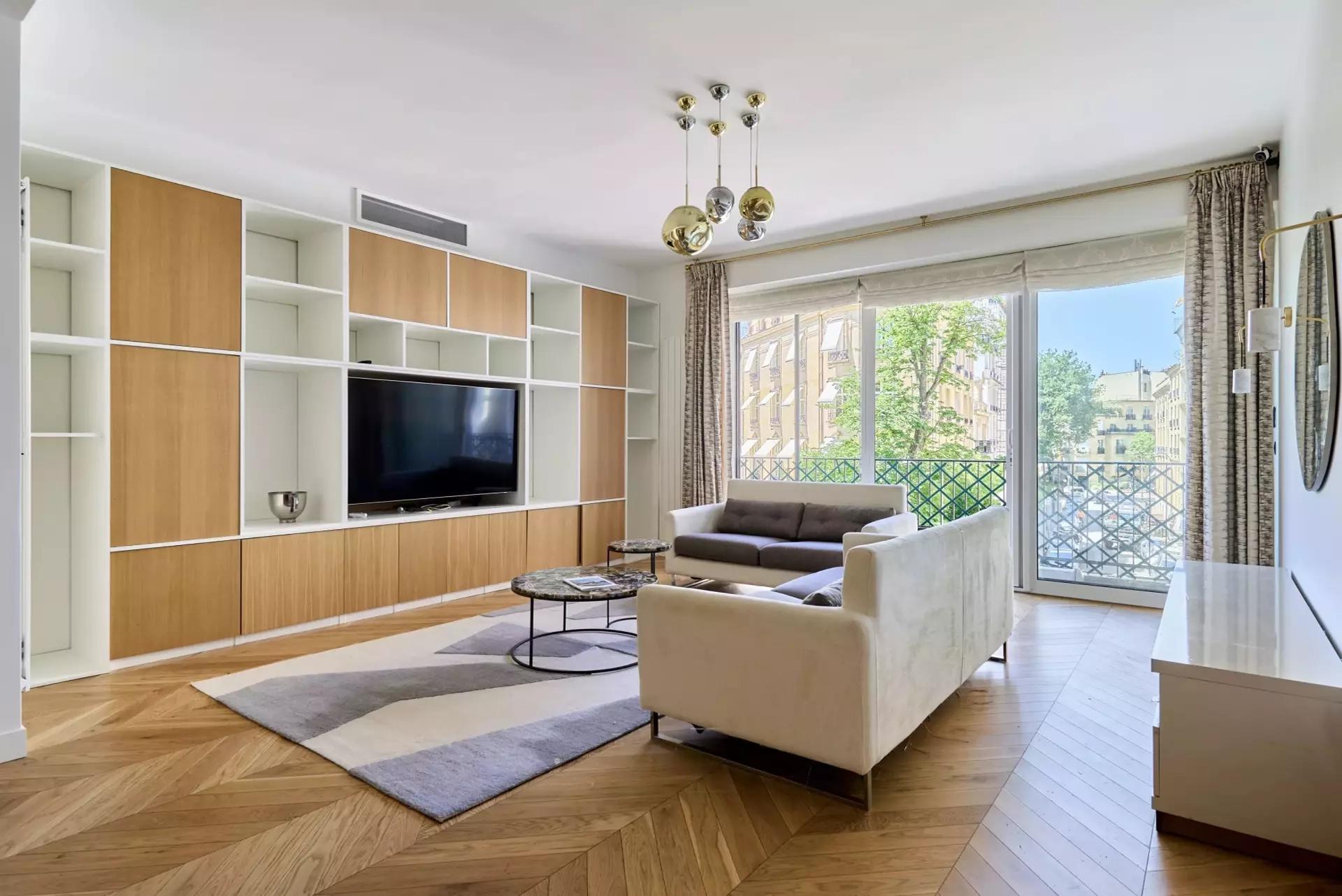 Bright fully furnished Paris apartment with elegant interiors, spacious living areas, balcony access, and comfortable amenities.