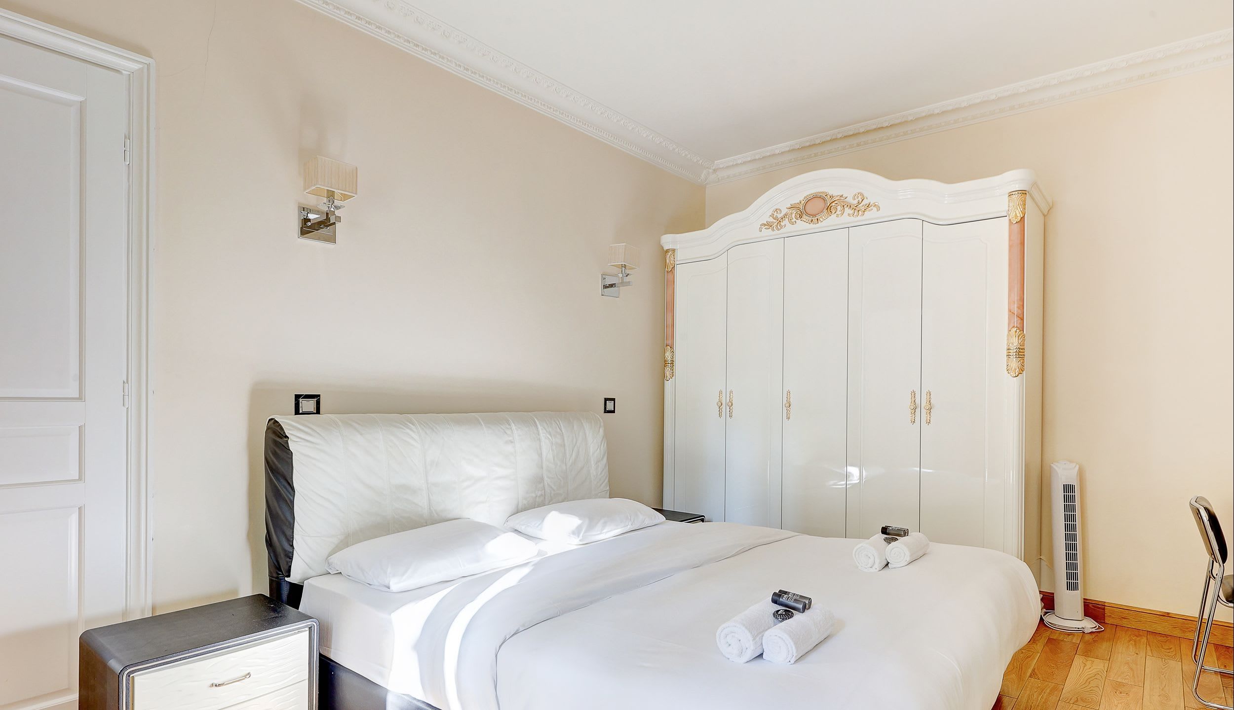 Bedroom 1: Double bed and storage space.