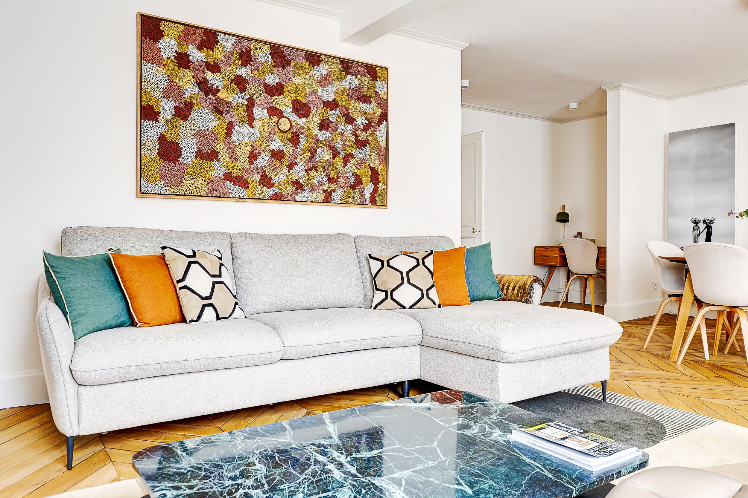 Bright and spacious living area with a sofa bed and dining space.