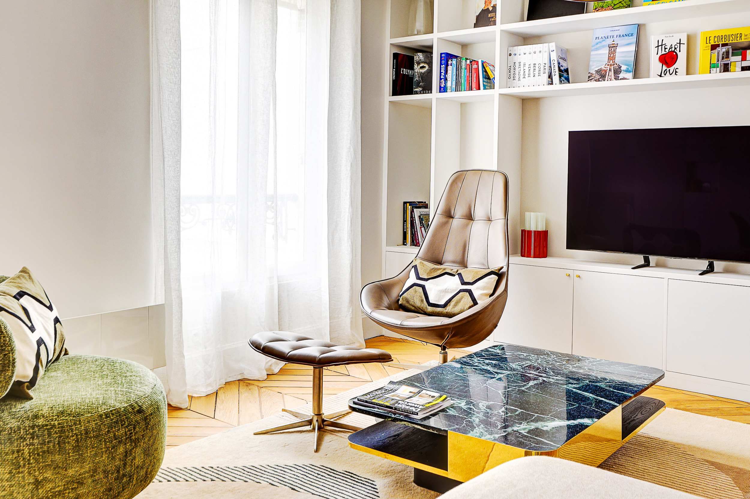 Bright and spacious living area with a sofa bed and dining space.