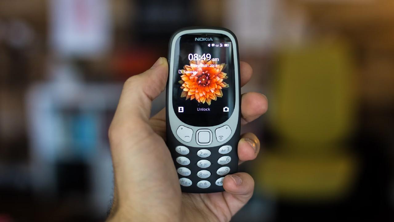 Känn friheten med en knapptelefon (dumb phone)