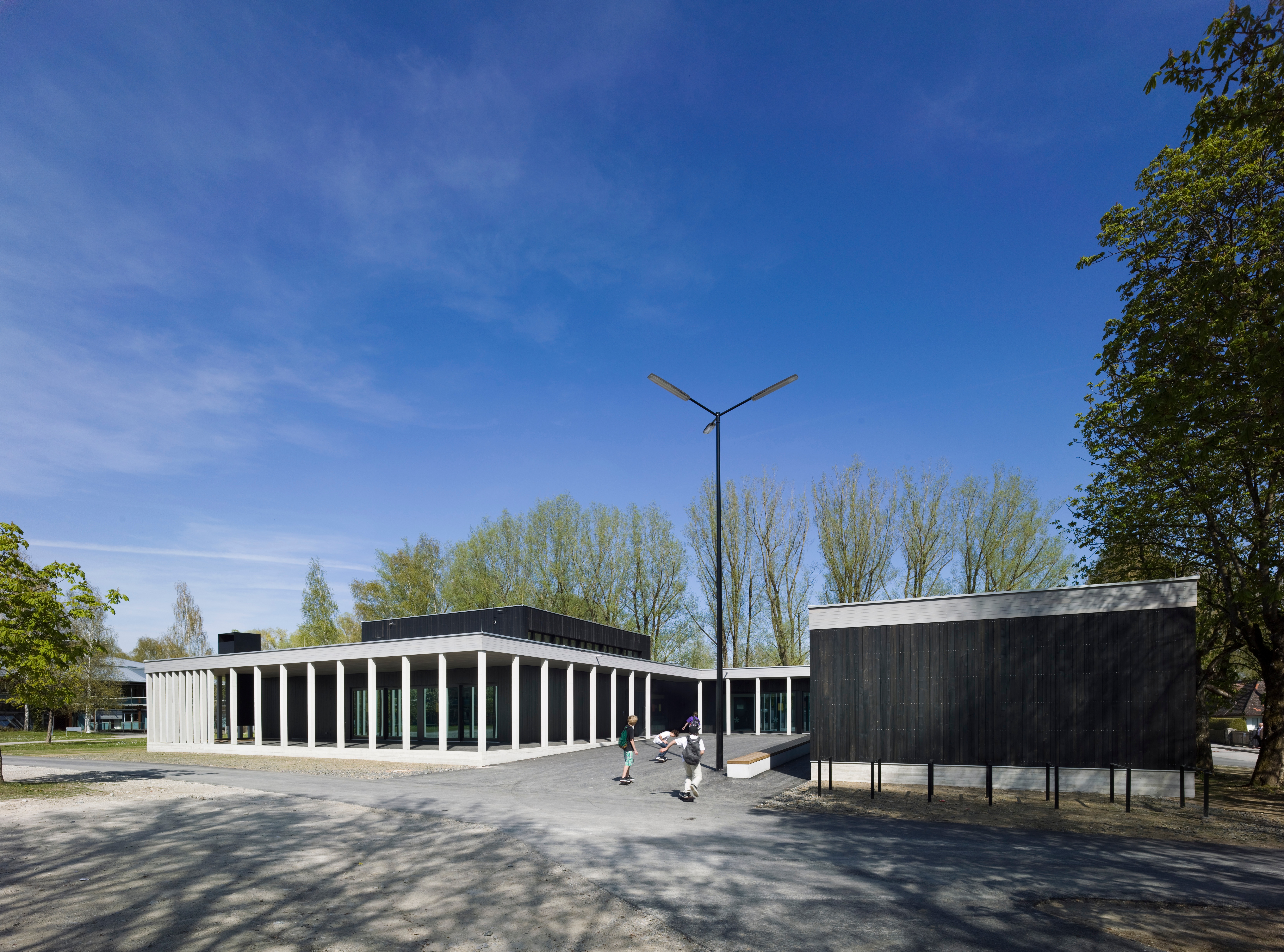 Goetz Castorph Lehmann Tabillion Architektur Städtebau München Starnberg Jugendzentrum Neubau Nepomuk Kamin Turnhalle Sporthalle Laterne