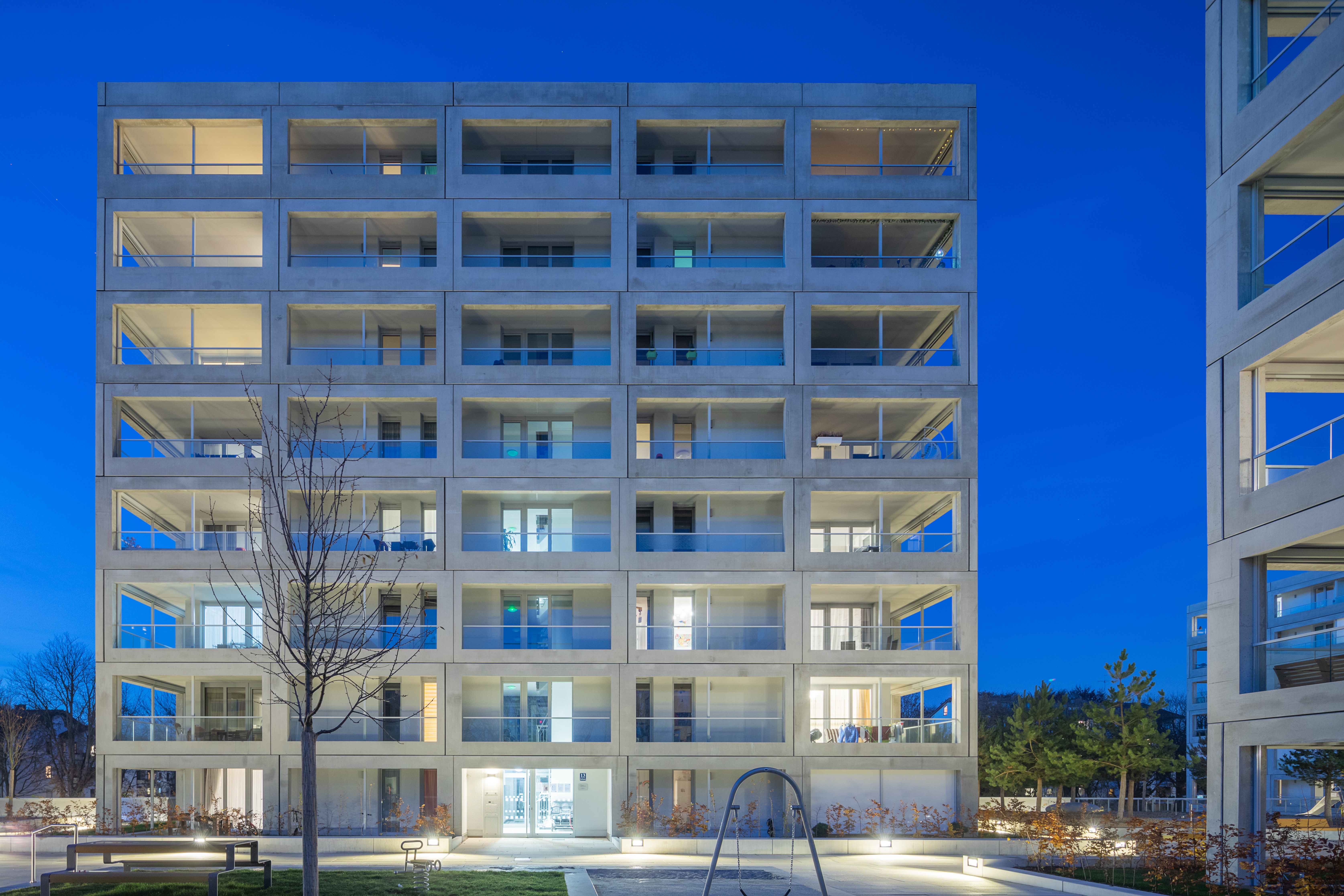 Goetz Castorph Lehmann Tabillion Architektur Städtebau München MAN Allach Gerberau Esplanade Beton Fertigteile umlaufend Balkone Sonnenschutz Rahmenelemente Punkthäuser Häusergruppe Loggien grün Park wohnen Quartier Plattform Innenhof