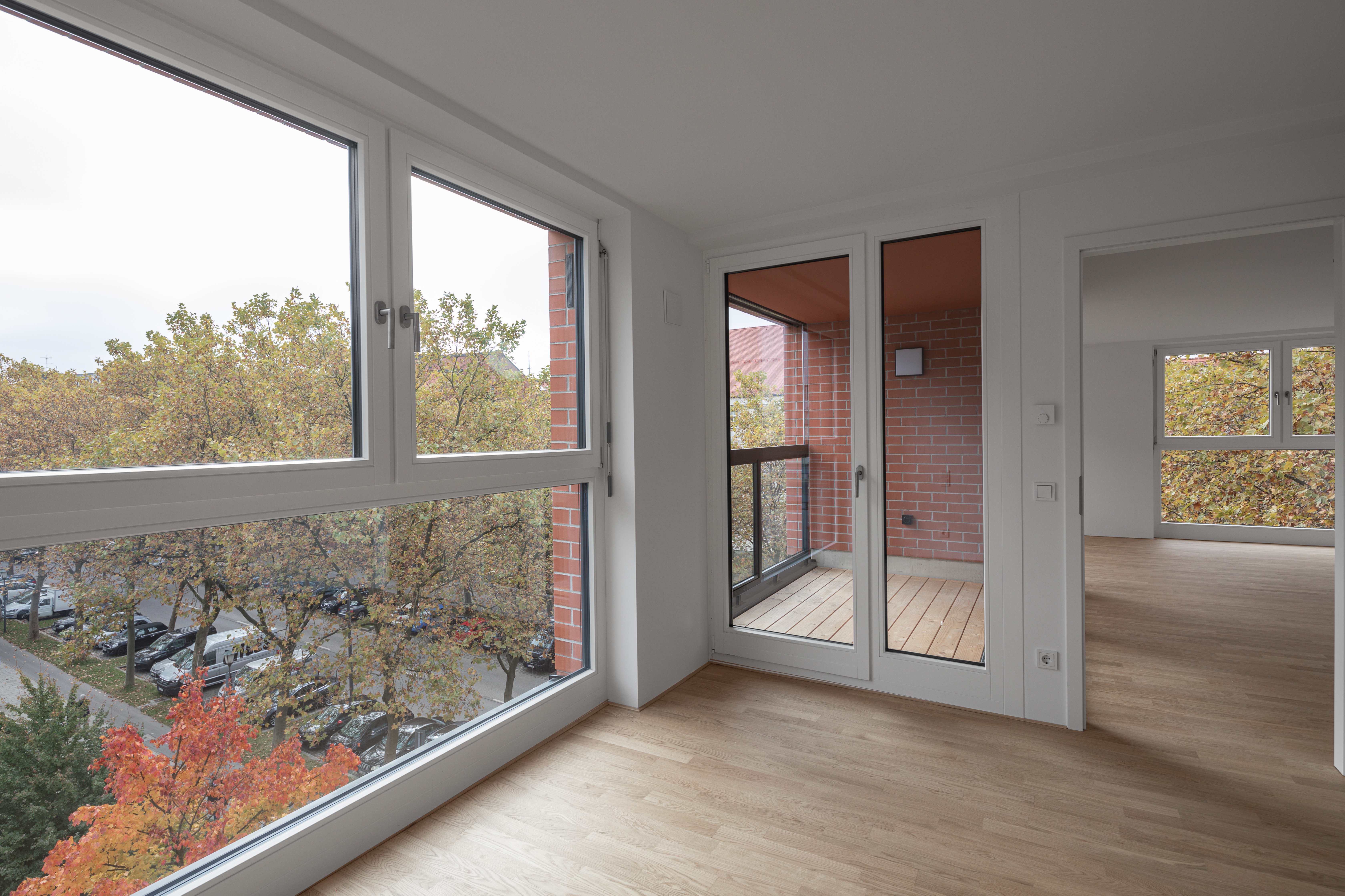 Goetz Castorph Lehmann Tabillion Architektur Städtebau München Ziegel rot Loggien Mehrfamilienhaus Sonnenschutz Klinker Fassade