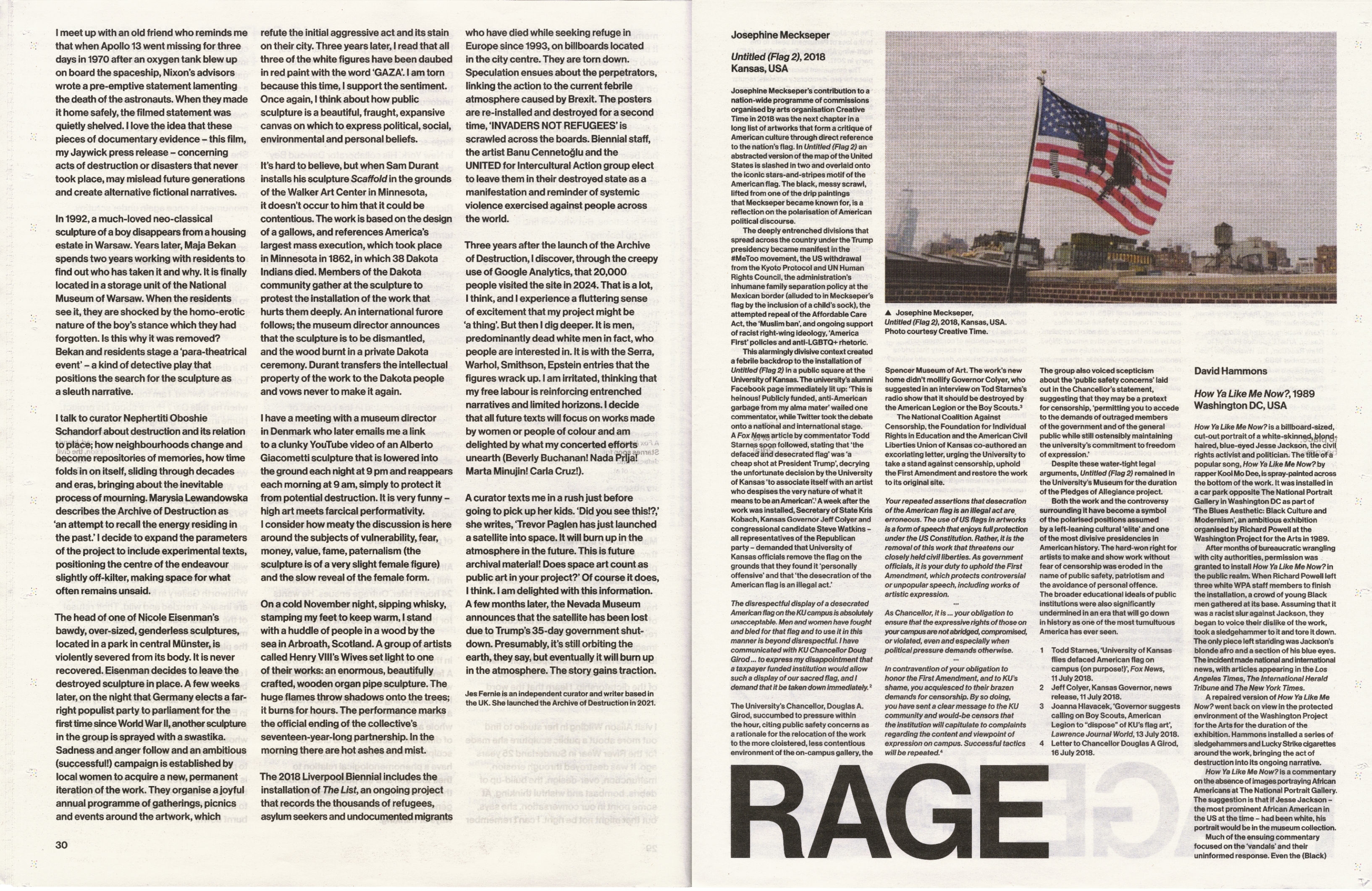 An American flag, bearing a black silhouette of a rifle-carrying figure, flies on a pole over a desolate urban landscape with scattered structures.