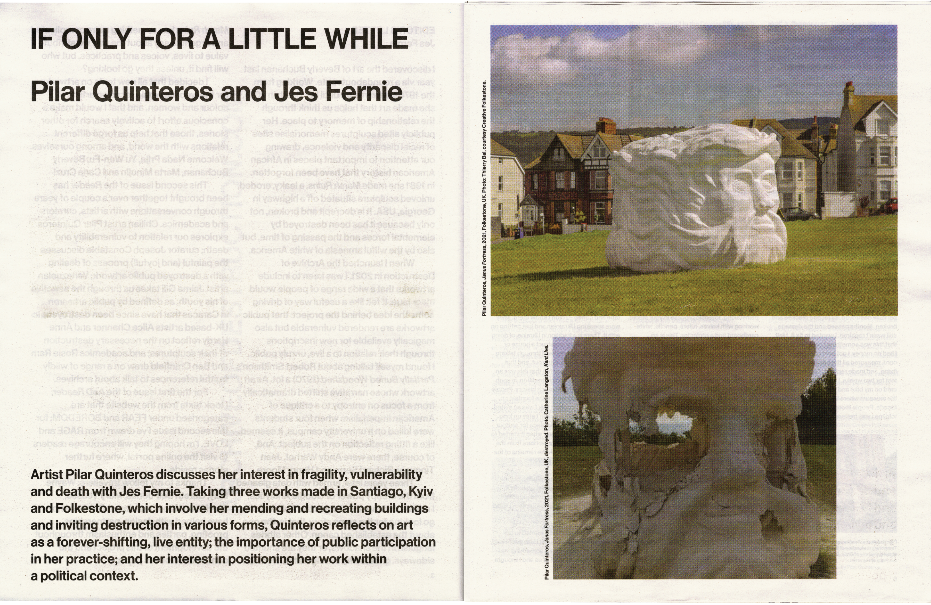 A publication page featuring two images of a large, white sculptural head on a grassy field; one appears intact with houses in the background, the other is broken open.
