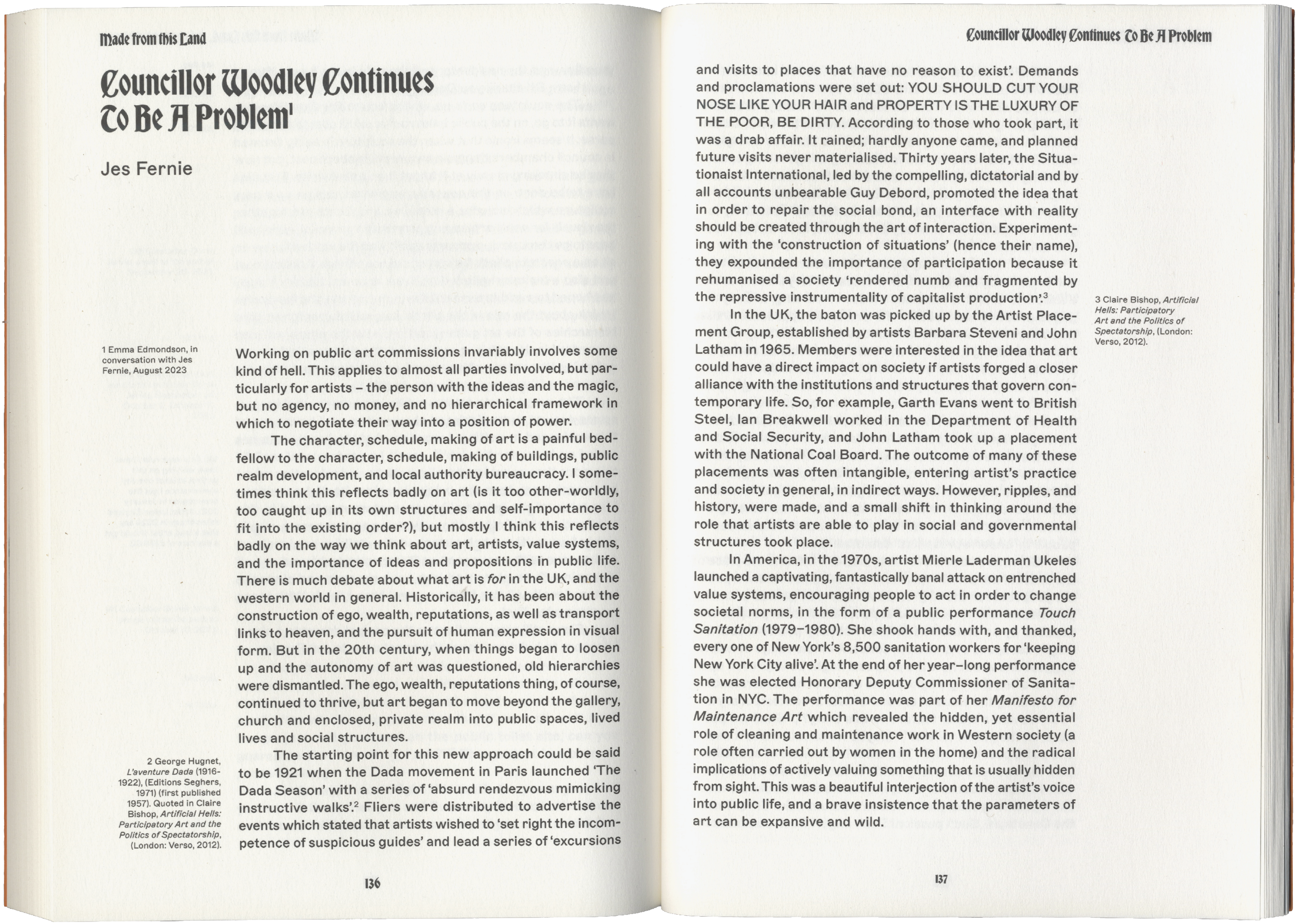 An open book showing an article titled 'Councillor Woodley Continues To Be A Problem' by Jes Fernie across two pages.