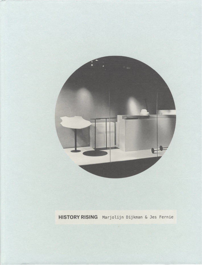 Light blue book cover with a central circular grayscale photo of a modern interior display with abstract elements and spotlights, and the text "HISTORY RISING Marjolijn Dijkman & Jes Fernie."
