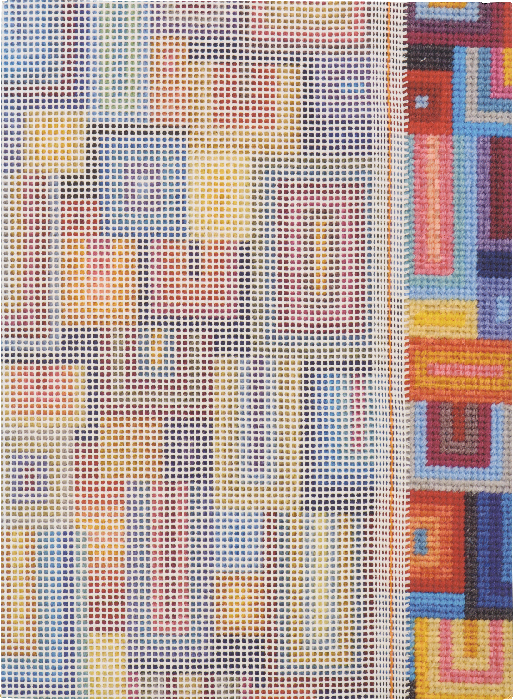A needlepoint canvas with an abstract colorful geometric pattern, partially stitched on the right side.