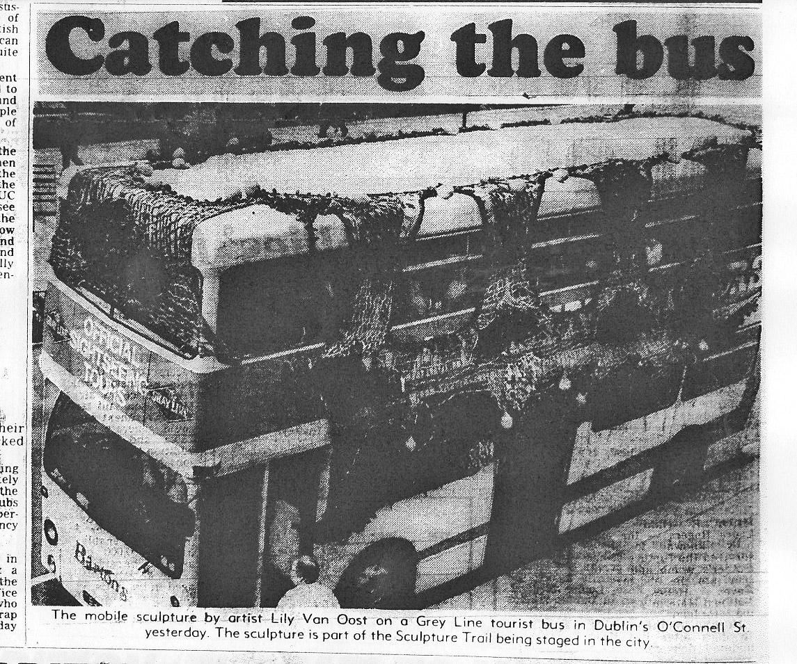 Black and white image of a double-decker bus covered in fishing net and various objects as a mobile sculpture, with the headline "Catching the bus".