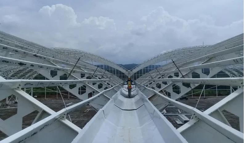 Dura LITE® FRP gutter being installed on an industrial roof