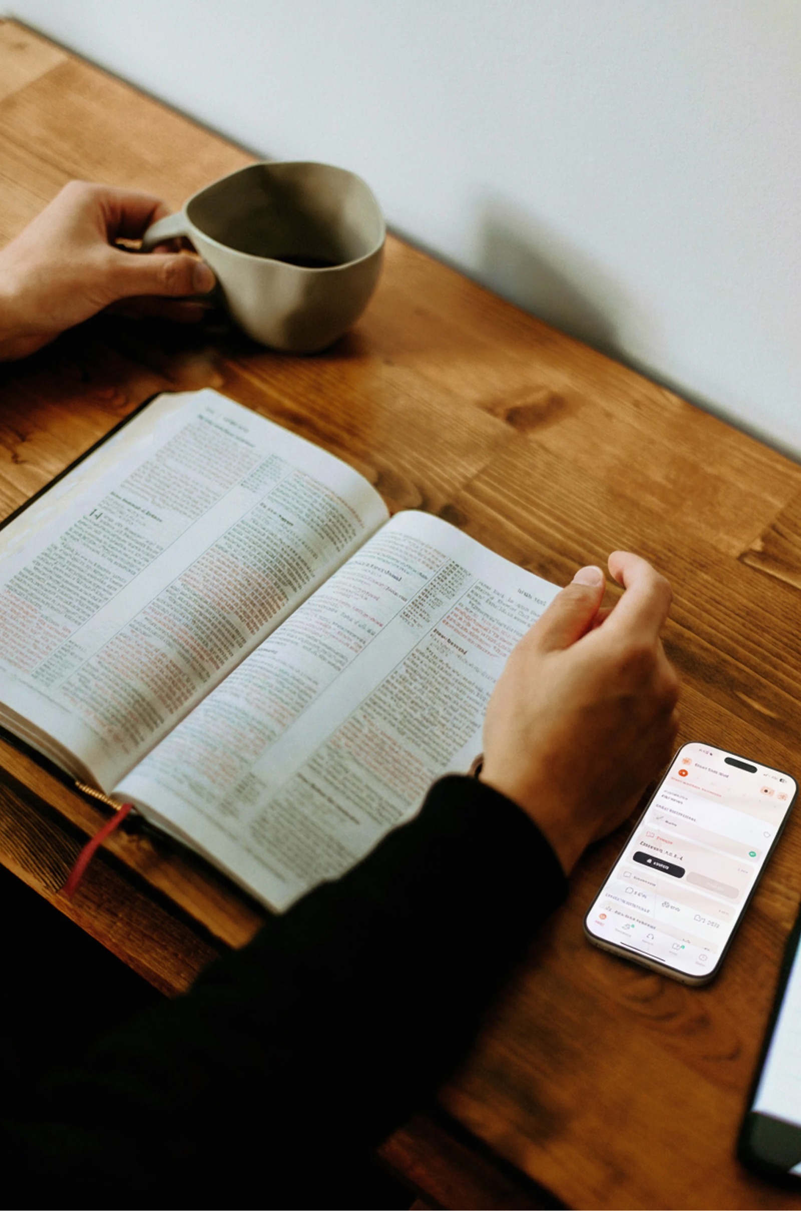Open Bible, notebook, and pens arranged for personal Bible study
