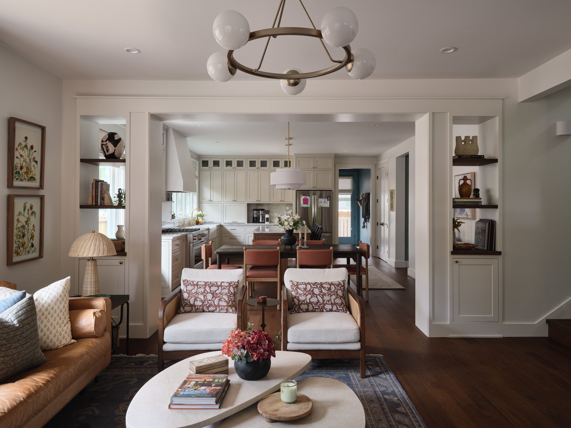 Open-plan living room leads into a dining area and kitchen