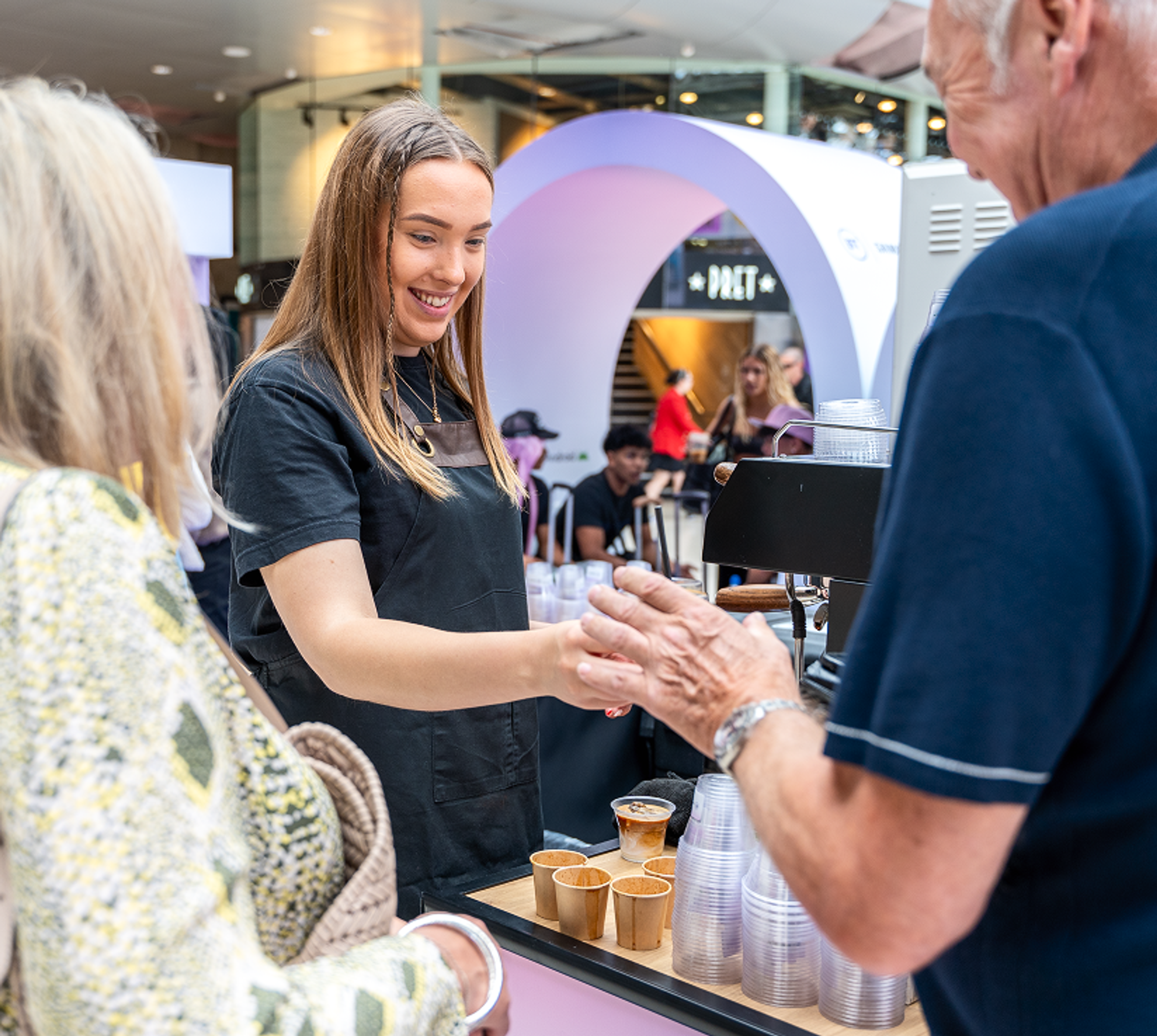 Visitors being served coffee at the BT Waterloo activation