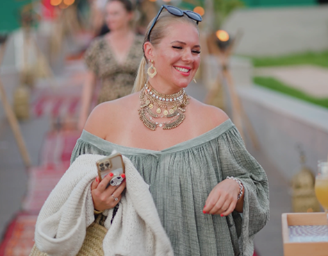 Nu Skin guest smiling at an outdoor reception in Morocco.