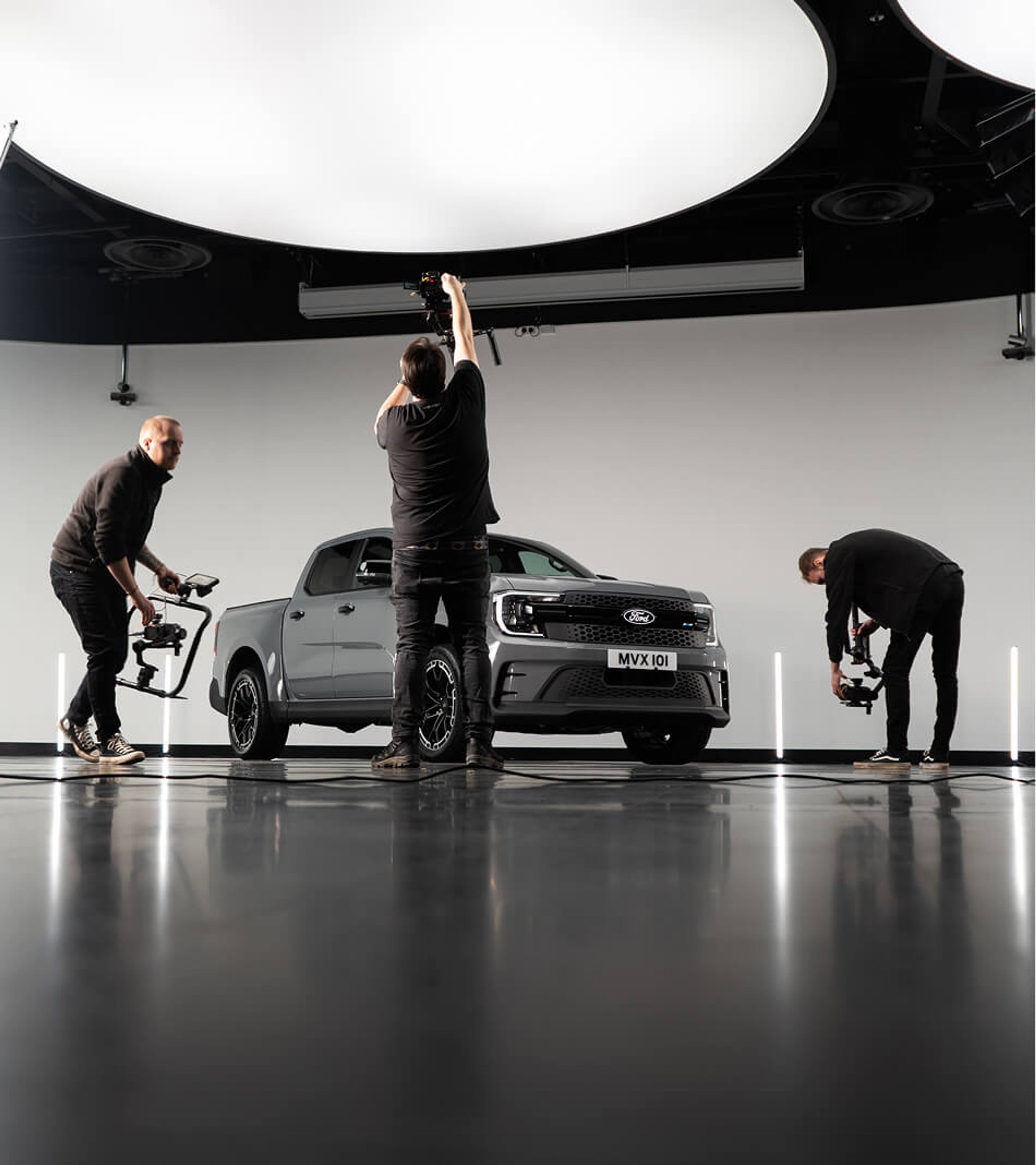 Film Crew Shooting Grey Ford Ranger MS-RT In A Studio