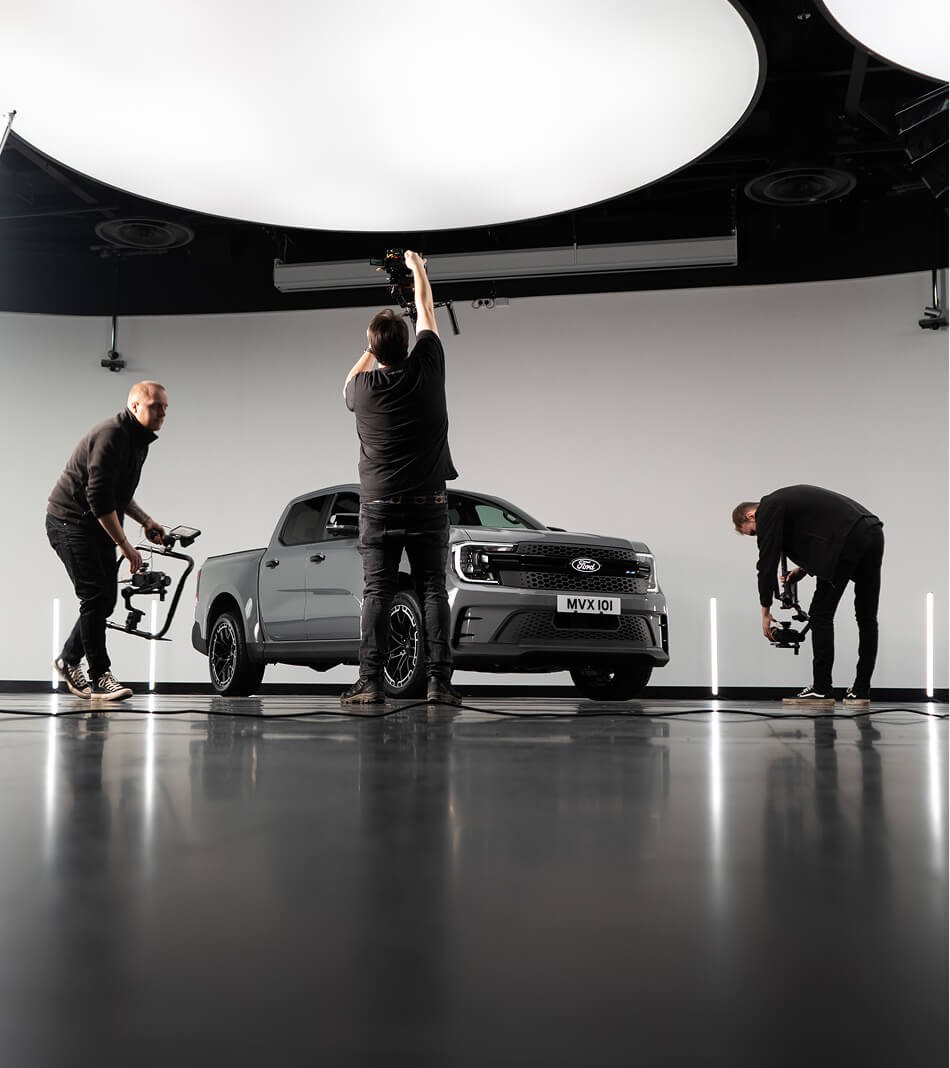 Film Crew Shooting Grey Ford Ranger MS-RT In A Studio
