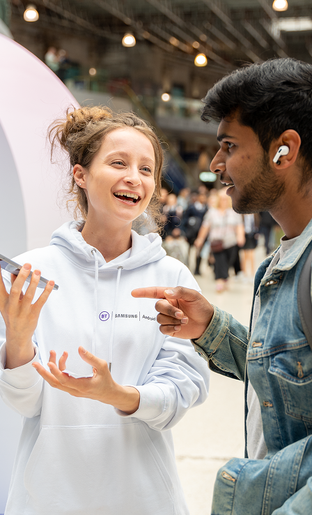 Brand ambassador engaging with a commuter at the BT Waterloo activation
