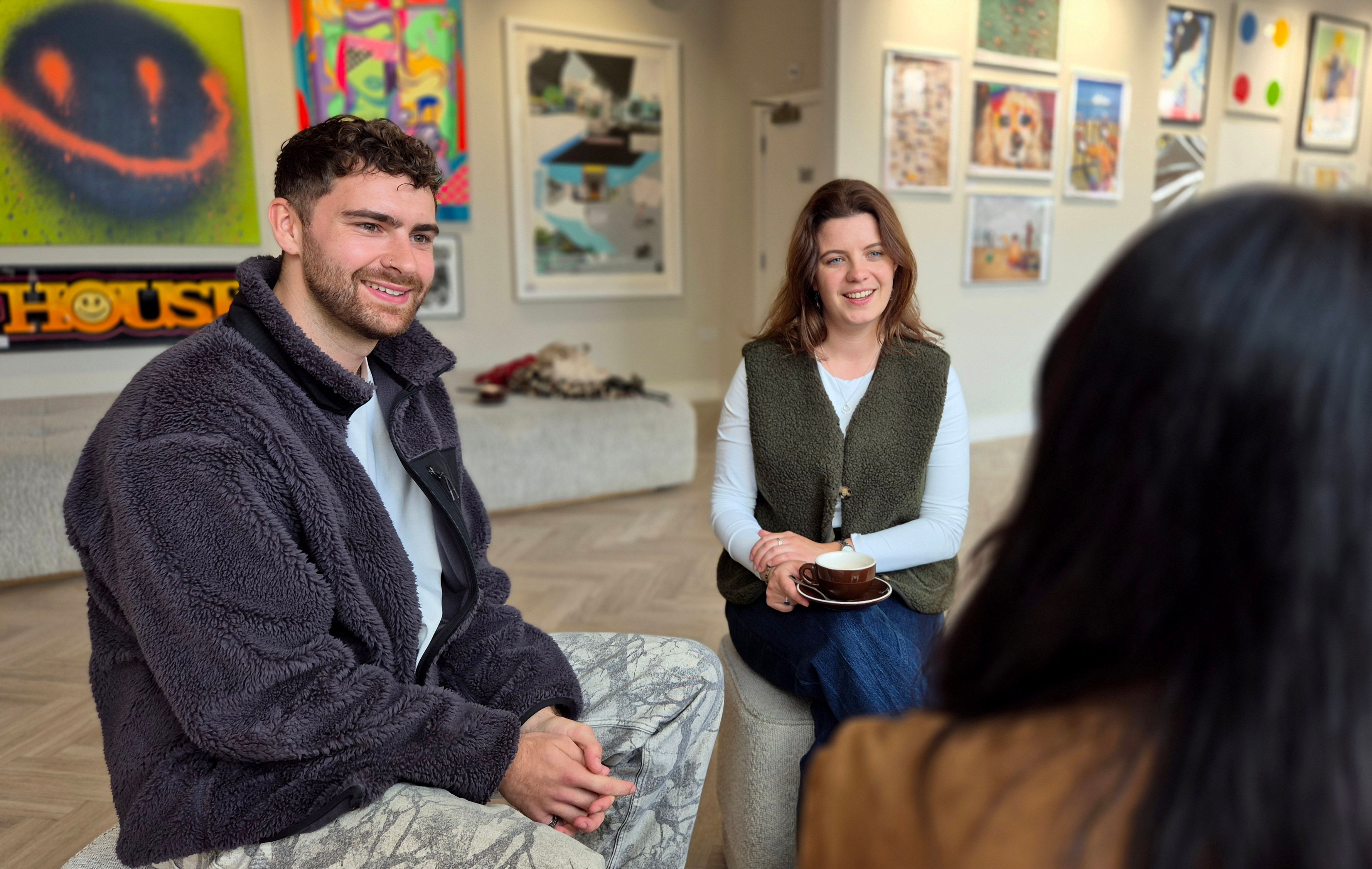 Two team members having a conversation in an art gallery