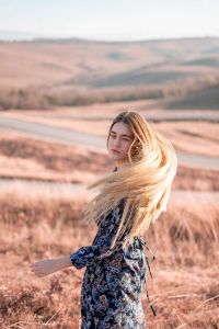 Rose Moore standing in a golden meadow